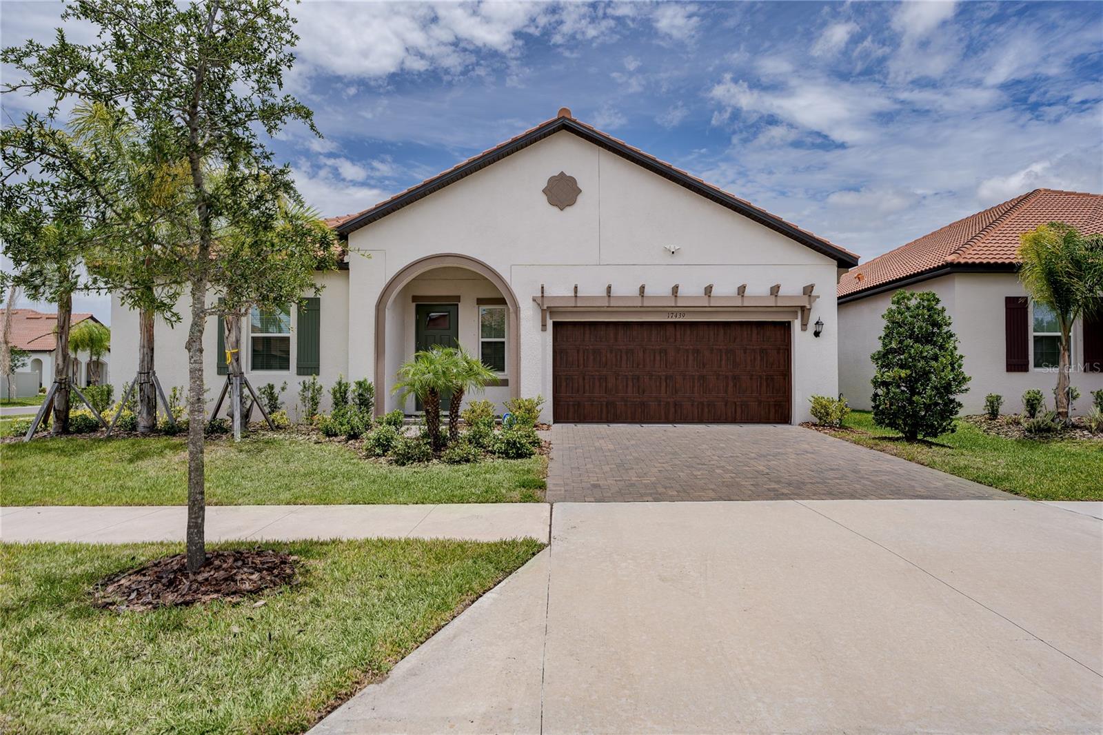Skip the wait to build and start enjoying Florida's premier active-adult lifestyle today. Located within the gated 55+ section of Southshore Bay, this like-new Lennar Argent floor plan offers modern, low-maintenance living paired with access to one of the area's most sought after resort style communities.

Thoughtfully designed for comfort and convenience, this spacious home features an open-concept layout where the kitchen, dining area, and great room flow seamlessly together, creating the ideal setting for everyday living and entertaining. A versatile flex space offers endless possibilities for a home office, hobby room, reading retreat, or fitness area. The private owner's suite features an oversized walk-in closet and spacious bath, while the secondary bedroom includes its own private bath, providing ideal accommodations for guests.

Step outside to the covered lanai and enjoy Florida's year-round sunshine, or take advantage of the added garage attic storage and extra garage closet, a valuable feature rarely found in many homes throughout the community. For added convenience, mounted televisions in both the great room and primary suite will convey with the sale.  For added peace of mind, the ADT alarm equipment which includes a Ring doorbell and security flood light camera are paid for and convey with the house.

Residents enjoy exclusive access to a private active-adult amenity center featuring a clubhouse, resort-style pool, fitness facilities, sports courts, social events, and activities designed to foster an active and connected lifestyle. In addition, Southshore Bay's world-famous crystal lagoon offers swimming, kayaking, paddle boarding, waterfront relaxation, and endless opportunities to enjoy the Florida outdoors.

Built in 2024 and ready for immediate enjoyment, this exceptional home offers the opportunity to move right in and begin living the resort lifestyle you've been dreaming about—without the delays, uncertainty, or additional expenses often associated with new construction.  Close to all kinds of shopping and restaurant choices and very easy access to Interstate 75 for commuting to Tampa, Manatee, St. Petersburg and sarasota.