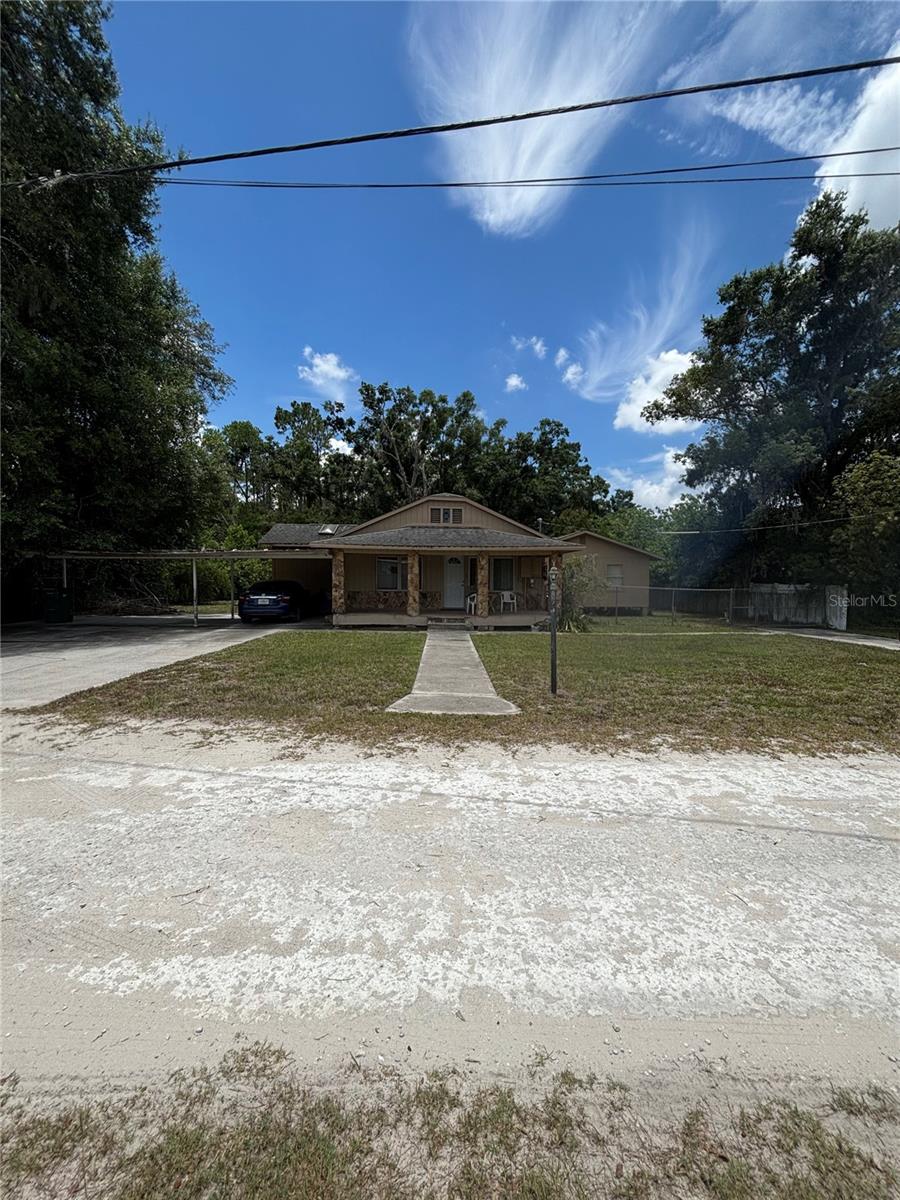 Incredible opportunity in the heart of Odessa! This home sits on a rare oversized 1/3-acre, fully fenced lot in one of the area's most sought-after corridors — minutes from SR 54 and Gunn Highway, and directly adjacent to Chick-fil-A and Lowe's, with shopping, dining, and everyday conveniences just steps away. Whether you're looking to renovate this charming piece of Odessa history or build new from the ground up, this property offers the space and location to make it happen. NOT in a flood zone, NO HOA, and NO CDD fees mean maximum flexibility and minimal restrictions for your vision. Property currently enjoys a homestead exemption. Lot size and central location like this rarely come available — don't miss your chance to secure land in this fast-growing, high-demand area!