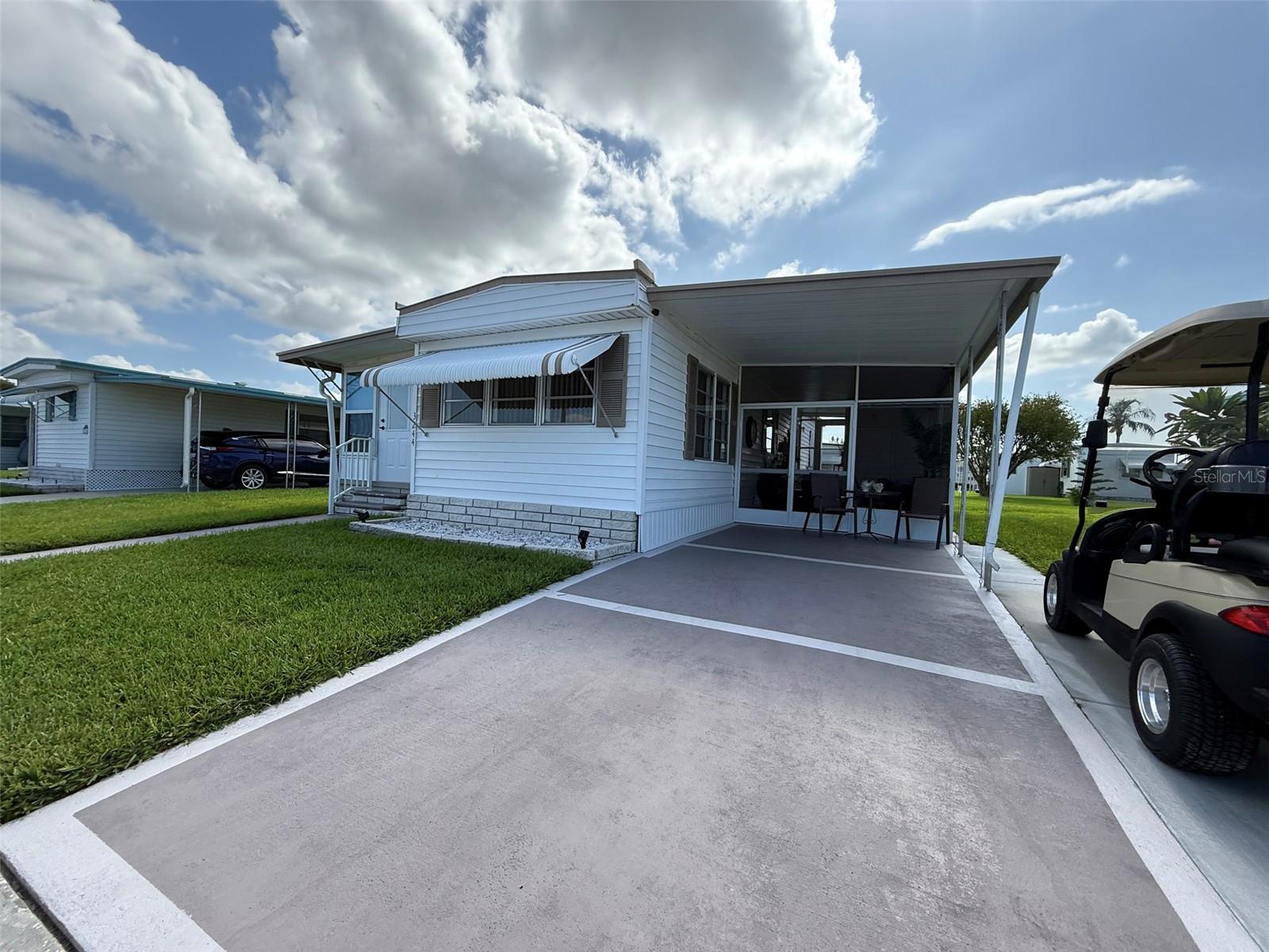 Enjoy Comfortable Florida Living in a Welcoming 55+ Community

Retire in comfort and embrace the tranquil Florida lifestyle in this beautifully maintained 1-bedroom, 1-bath home, located in a friendly 55+ land-owned community with no lot rent. This charming residence is offered fully furnished, with most contents included—essentially what you see is what you get.

The home has benefited from numerous renovations, including a completely updated Florida room, kitchen, bathroom, screened-in lanai, and rear patio. The driveway has been widened to accommodate your car and a golf cart, adding both convenience and functionality. The Florida room can easily be converted into a second bedroom, making it ideal for visiting guests.

Exceptional curb appeal welcomes you home, while the large covered, screened-in lanai provides the perfect space to relax and enjoy Florida’s sunshine. All backyard patio and screened lanai furniture are also included.

This active community offers amenities designed for relaxed, social living, including a heated pool, clubhouse with planned activities, lawn care, and trash service, all covered by a low HOA fee. The home is within walking distance of the community pool, enhancing its appeal.

Whether you are a seasonal snowbird or planning to retire full-time, this move-in-ready, low-maintenance home offers affordable living in a peaceful setting.

Sold As Is.
Measurements are approximate. All information is deemed reliable but should be independently verified by the buyer.