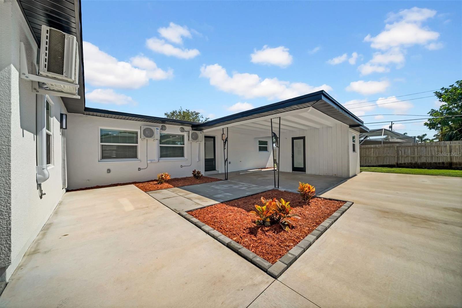 Exceptional turnkey duplex opportunity in the heart of St. Pete Beach — just a short walk to the sugar sand beaches, dining, shopping, and everything this vibrant coastal community has to offer. This upscale, fully furnished income-producing property features a beautifully renovated 3-bedroom, 2-bath residence alongside a stylish 2-bedroom, 1-bath unit, plus a detached air-conditioned studio offering additional flexibility for guests, office space, storage, or creative use.

Extensively rebuilt and expanded with permits, this property underwent a significant full-gut renovation with no expense spared. Designed for long-term durability, low maintenance, and modern luxury living, nearly every component of the property has been thoughtfully upgraded to today’s standards.

High-end improvements include smooth drywall finishes, recessed lighting, upgraded stucco, soffit and fascia, oversized PVC wastewater plumbing, PEX water piping, separate water and electric meters, updated irrigation system, and completely upgraded electrical systems brought to the latest code requirements. The property also features high-efficiency impact-rated dual-pane windows, impact exterior doors, new mini-split AC/heat systems, and upgrades to current Florida hurricane standards including wraparound hurricane straps for added peace of mind and potential insurance savings. (Wind MIT. And 4 pt available)

Interior finishes offer a true luxury coastal feel with solid wood shaker cabinetry, quartz countertops, stainless steel appliances with infrared cooktops, luxury vinyl plank flooring, solid-core shaker doors, smooth plaster walls, Kohler porcelain tubs and toilets, porcelain tile with epoxy grout, and front-load stainless steel washers and dryers throughout.

Outside, enjoy newly installed driveways with valuable off-street parking for up to 8 SUVs — a rare find near the beach. Whether you are searching for a luxury beach investment, vacation rental opportunity, multi-generational setup, or personal coastal retreat with income potential, this one-of-a-kind St. Pete Beach property delivers exceptional versatility, craftsmanship, and location.