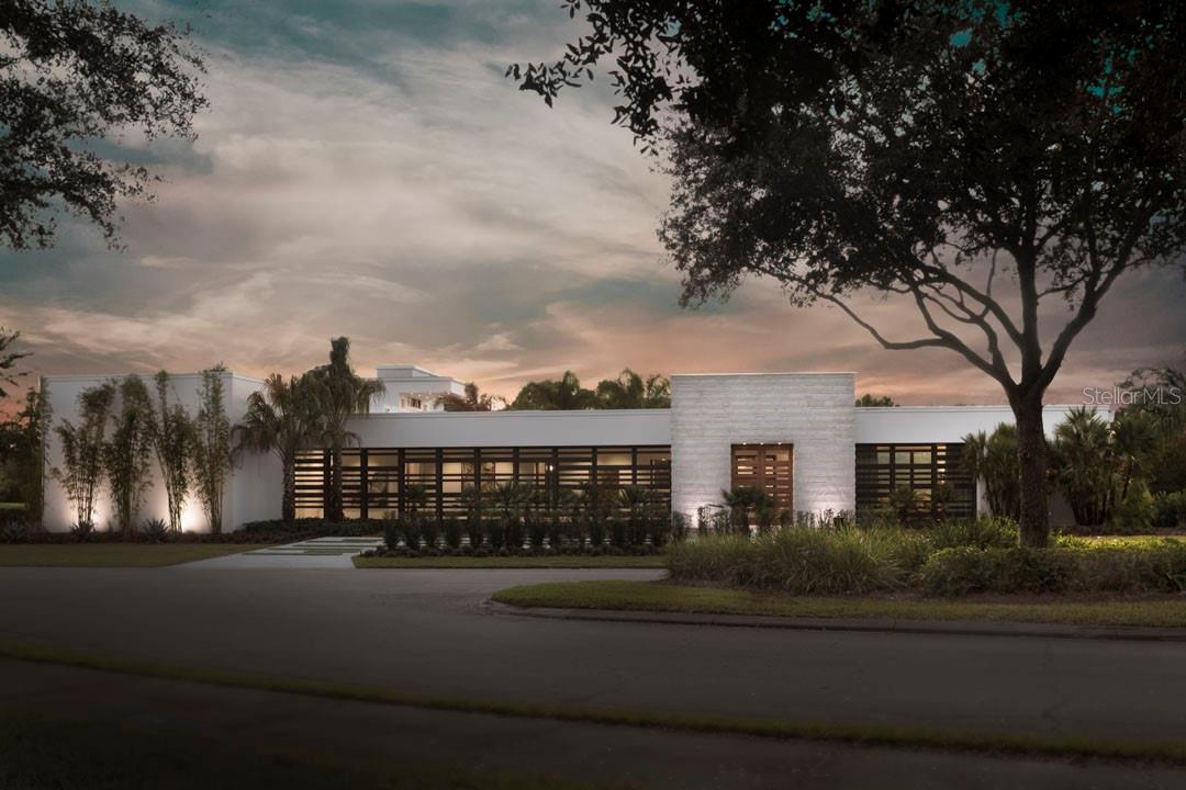 The 2017 New American Home is perfectly situated along the back nine of Lake Nona Golf & Country Club’s world-renowned championship golf course, cutting-edge sustainability, and stunning contemporary design are the hallmarks of this Phil Kean Design Group home. Enjoying multiple golf and water views, the home displays a superb use of glass, openness, and seamless transitions from indoor to outdoor living with covered porticos and lanais. The home features over 8,245 square feet of living space, plus a 1,775 square foot rooftop terrace which is positioned to maximize the incredible views. Focused on the main level, the home’s open floor plan includes five bedrooms, six full and four half bathrooms, and flows from an open-air, interior courtyard entry with a media room, into the grand foyer that shares a glass fireplace with the great room, which is surrounded by automated, fully-pocketed sliding doors, and is anchored by a floor-to-ceiling glass-enclosed wine bar.  The sleek kitchen is highlighted by state-of-the-art Wolf and Sub-Zero appliances surrounded by Ceasarstone counters and high gloss cabinetry. Complete with an expansive walk-in closet and magnificent bath, the owner’s suite boasts unique luxuries, including a morning bar with a Wolf coffee system, a safe room, and one of three laundry stations. Just outside the owner’s suite sits a private lanai with a fireplace and access to the health and wellness space, which features a steam room, private powder bath, and space for massage or exercise. The ample outside living area is centered on an infinity-edge pool, which features an expansive sun shelf and floating spa, all meticulously integrated into the international architectural style. Additional details include: LEED Gold Platinum certification/pod style architecture, Solar to 18KW, Tesla backup batteries and whole house generator, Outdoor Phantom screens/indoor Lutron blinds, Full guest casita with private lanai, Imported glass Belgian stairway, Gallery, Theater room, Elevator and Two, 2-car garages.
Note: The adjacent, vacant .78-acre home site can be purchased with the home.