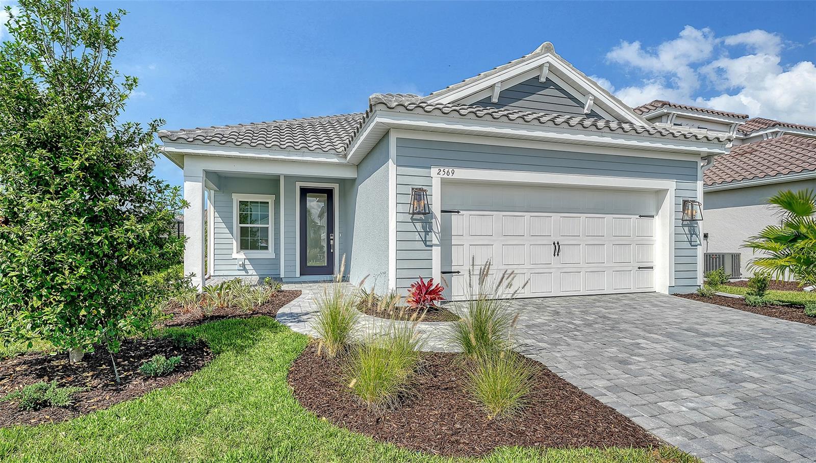 A luxurious home embodying the carefree, relaxed Florida lifestyle, the Dream 2 is a beautifully designed 3-bedroom, 2-bath single-family home with a 2-car garage. Featuring tile flooring throughout the home, this open-concept floor plan combines style, comfort, and easy maintenance. The spacious kitchen offers a corner pantry, center island, abundant counter space for culinary creativity, and an adjoining dining area perfect for everyday living and entertaining. The great room features pocket sliding glass doors that open to the lanai, creating an inviting indoor-outdoor living experience ideal for enjoying the Florida sunshine. The private primary suite includes two closets, dual vanity sinks, and a walk-in shower. A separate den, utility room, two additional bedrooms, and a full guest bath complete this thoughtfully designed home.