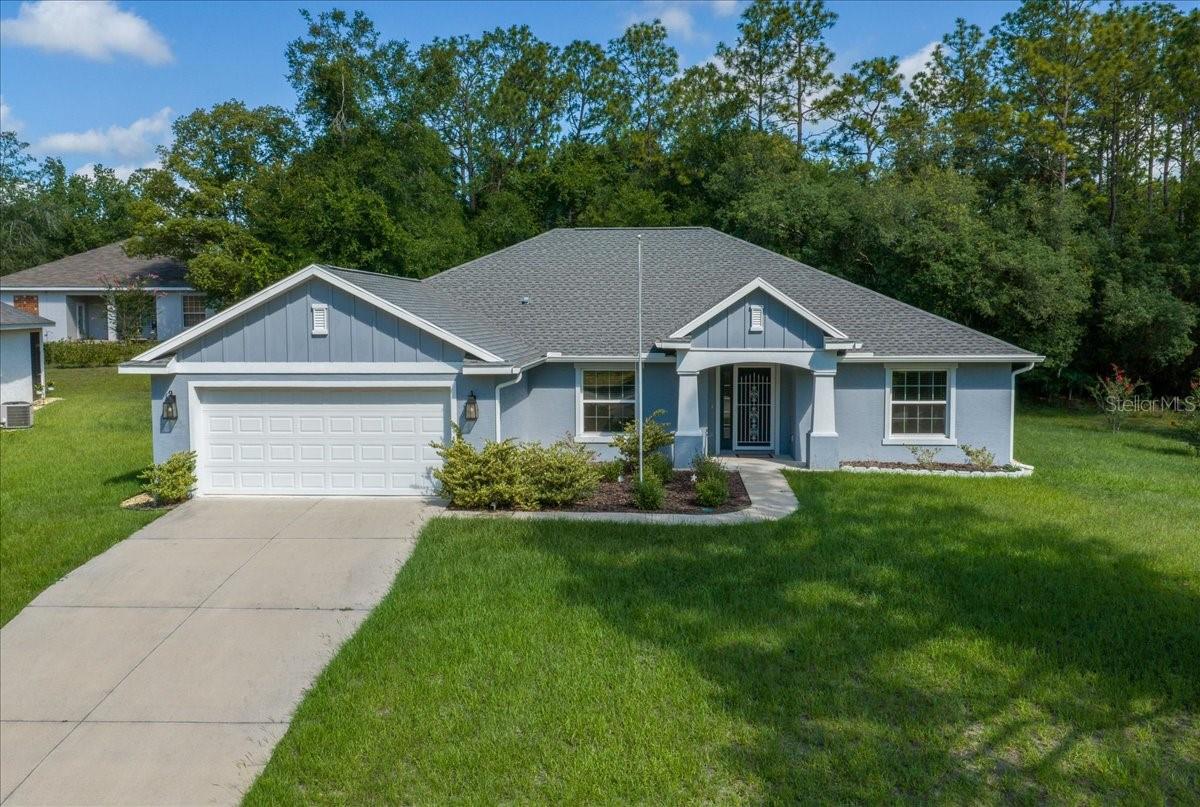 Welcome Home! Tucked away on a quiet cul-de-sac in the beautiful Rainbow Springs community, this hidden gem is a like-new 2022 home built by Triple Crown Homes, known for quality craftsmanship and attention to detail. Very lightly lived in and meticulously maintained, this move-in-ready home offers 1,976 square feet of thoughtfully designed living space on a generous .31-acre lot.??

The open-concept design and split bedroom floor plan provide the perfect balance of spacious living and privacy. The great room is generously sized, making it ideal for entertaining family and friends or simply relaxing. Beautiful tile flooring flows throughout the main living areas, while soft carpeting adds warmth and comfort to each bedroom. The spacious Owner's Suite offers plenty of room to relax and features 2 large walk-in closets, private ensuite bathroom, and an upgraded glass shower enclosure. Additional upgrades throughout the home include gutters, ceiling fans, window coverings, and a screened porch that extends your living space outdoors—perfect for relaxing, entertaining, or simply enjoying Florida's beautiful year-round weather. With the finishing touches already completed, you'll enjoy all the benefits of a nearly new home from day one.

Living in Rainbow Springs is about much more than owning a beautiful home—it's about embracing an incredible lifestyle. Residents enjoy access to the Rainbow Springs Country Club featuring a community pool, pickleball, tennis courts, bocce ball, billiards, horseshoes, a fitness center, restaurant and bar & grill, and organized community activities. Ownership also includes private access to the crystal-clear Rainbow River where you can swim, kayak, canoe, paddleboard, tube, picnic, or simply relax by the spring-fed water. Miles of scenic walking trails, the park’s iconic waterfalls, and abundant wildlife make this one of Florida's most treasured communities.

Conveniently located just minutes from shopping, restaurants, and healthcare, and only a short drive from the World Equestrian Center, you'll enjoy the perfect balance of peaceful living and everyday convenience.
Whether you're searching for your forever home or a seasonal Florida retreat, this exceptional property offers the rare opportunity to own a nearly new, high-quality home in one of Marion County's most sought-after communities. Come experience the beauty and lifestyle of Rainbow Springs—schedule your private showing today!