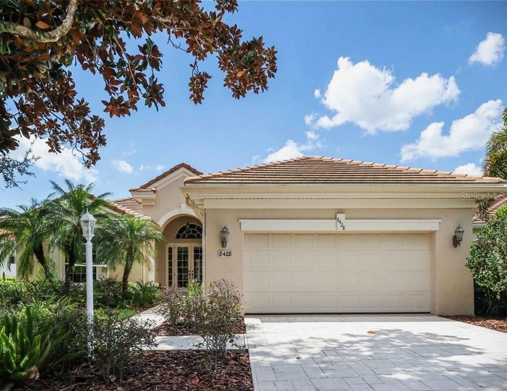 New Price Improvement - An  Exceptional Opportunity... To your private waterfront retreat in the highly sought-after gated community of Edgewater in the heart of Lakewood Ranch! Perfectly positioned on a quiet cul-de-sac, this exceptional Arthur Rutenberg home sits on a lush homesite with tranquil pond and preserve views, offering rare privacy and breathtaking natural beauty. Just a short stroll away you’ll find Lakewood Ranch’s vibrant Main Street with popular restaurants, boutique shopping, mini golf, and the cinema—placing dining, entertainment, and everyday convenience right at your doorstep! The moment you step through the elegant double French doors, you’re welcomed by soaring ceilings, an open foyer, and a dramatic wall of pocketing sliding glass doors that immediately draw your eye to peaceful water views & surrounding nature. The home was designed to fully embrace Florida’s coveted indoor-outdoor living, creating a seamless flow between the interior living spaces and the expansive lanai. Imagine relaxing in your private pool and spa while enjoying spectacular sunset skies reflecting across the water, or hosting unforgettable gatherings with family and friends. This outdoor setting truly feels like your own private oasis. The expansive well-appointed kitchen is both beautiful and functional, featuring ample cabinetry, stone countertops, stainless steel appliances, a large center island & generous pantry space. The adjoining morning room showcases stunning nature views through a large aquarium window & includes a convenient built-in desk—perfect for keeping organized!  Just off the kitchen, the great room is designed for comfortable everyday living and effortless entertaining. The 10-13-ft ceilings, crown moldings, cozy fireplace & custom entertainment wall with built-ins create an inviting atmosphere. The spacious primary suite is a peaceful retreat with private lanai access & a cozy sitting area. The spa-inspired bath offers dual vanities, a soaking tub, walk-in shower, & two closets for exceptional storage. Two guest bedrooms—one currently used as a second den—are privately located behind a pocket door & share a full bath, creating an ideal layout for family or visitors. A dedicated den/media room with additional custom wood built-ins offers flexible space for a home office, library, or entertainment room. Additional highlights not to be missed include a convenient pool bath, a spacious laundry room with cabinets & utility sink, low HOA fees, A NEW ROOF in 2021, tankless water heater & fresh interior/exterior paint completed in 2026—providing peace of mind for years to come. Homes with this combination of privacy, water views, prime location, and quality Arthur Rutenberg craftsmanship rarely come available.  Edgewater Village residents enjoy their own access to Lake Uihlein 's private boat & kayak launch & storage! Spend time on the trails around the Lake or fishing and relaxing on the Pier with a charming Gazebo. The location of Edgewater Village can't be beat & is ideally situated just minutes from Lakewood Ranch Main Street, San Marco Plaza, Waterside Place & the Center Point development--offering an abundance of upscale shopping, dining & year-round entertainment. Enjoy convenient access to I-75, the UTC Mall, top-rated healthcare, A-rated schools, golf memberships at local clubs & award-winning Gulf Coast beaches too!