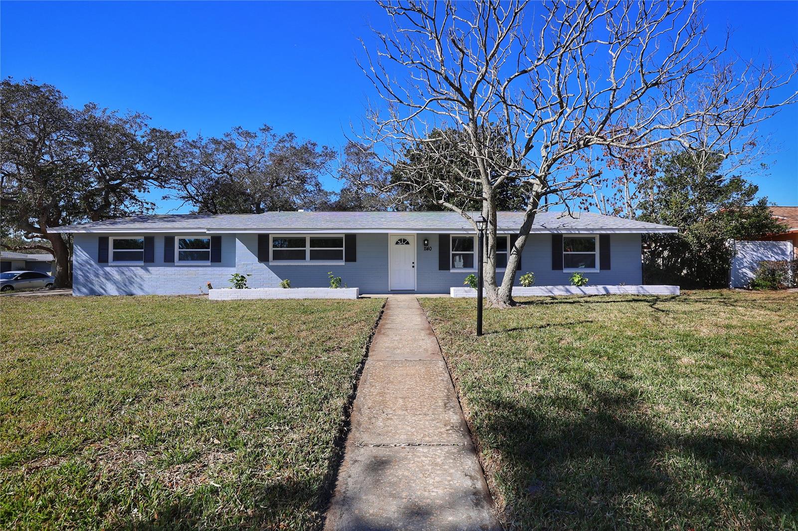 You have found the most meticulously remodeled home in Daytona Beach. This very family and retiree friendly neighborhood is centrally located to all your local shopping necessities, LPGA, Tanger Outlets, I-95, and of course within 10 minutes to Daytona Beach- Ideal location. This immaculate 3 bedroom 2 bath home sits on a corner lot, and has plenty of space for Rvs, Boats and all your toys and NO HOA. Beautiful curb appeal from the freshly painted exterior, fenced yard, patio in the back to enjoy the beautiful Florida weather, freshly painted planters out front and lush landscaping. This home features a Brand New Roof 11/2022, Newer A/C, New Duct work, Newer water heater and Oversized garage. Step inside to the open and bright floor plan, which features a large great room that is open to the renovated kitchen and dining area. The kitchen also offers shaker cabinets, New Subway tile, open shelving storage, granite countertops and stainless steel appliances. The Primary bedroom offers tons of space along with a private en-suite bathroom, the bathroom has dual sinks, updated cabinets/counters and a gorgeous updated shower. This home also features a split floorplan, that has two additional updated guest rooms that share a stunning Remodeled bathroom with a tub/shower combo. This Beautiful home has just so many extras, Newer Energy Efficient Windows throughout, New Interior and Exterior doors, Newer Recessed lighting, NEW Cabinets, NEW Flooring, NEW Appliances, NEW Fixtures, NEW Interior Paint, and so much more. This home is so welcoming and tucked away in a quiet neighborhood between I95 and the beach, this home is turn key and ready to be yours. This is your chance to own the PERFECT home in Daytona Beach on a corner lot with privacy and a short 10 minute drive to the beach. A True Must See to Appreciate One Of a Kind Property, schedule a showing today- this one wont last long. *All measurements deemed to be accurate, buyer to verify. ;Water: City