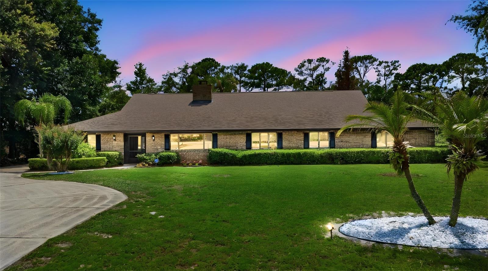 Virtually Staged. Welcome to this stunning lakefront retreat where luxury living meets Florida's natural beauty. This brand-new listing offers an extraordinary 3,743 square feet of thoughtfully designed living space, featuring 4 spacious bedrooms and 3 beautifully appointed bathrooms — perfect for families who demand both comfort and space.

Step outside and discover your private oasis, complete with a sprawling 684-square-foot pool that beckons you to unwind beneath the Florida sun. The .91 of an acre generous lot stretches to the water's edge, delivering breathtaking lake views that transform every morning into a postcard-worthy experience. Whether you're hosting poolside gatherings or enjoying quiet evenings watching the sunset shimmer across the water, this outdoor space is nothing short of spectacular.

Car enthusiasts and hobbyists will marvel at the oversized 5-car garage — a rare find that provides endless possibilities for storage, workshops, or an impressive vehicle collection. The quality of construction throughout this home reflects superior craftsmanship.

This is more than a home — it's a lifestyle defined by space, serenity, and exceptional quality. Schedule your private showing today before this lakefront gem slips away.