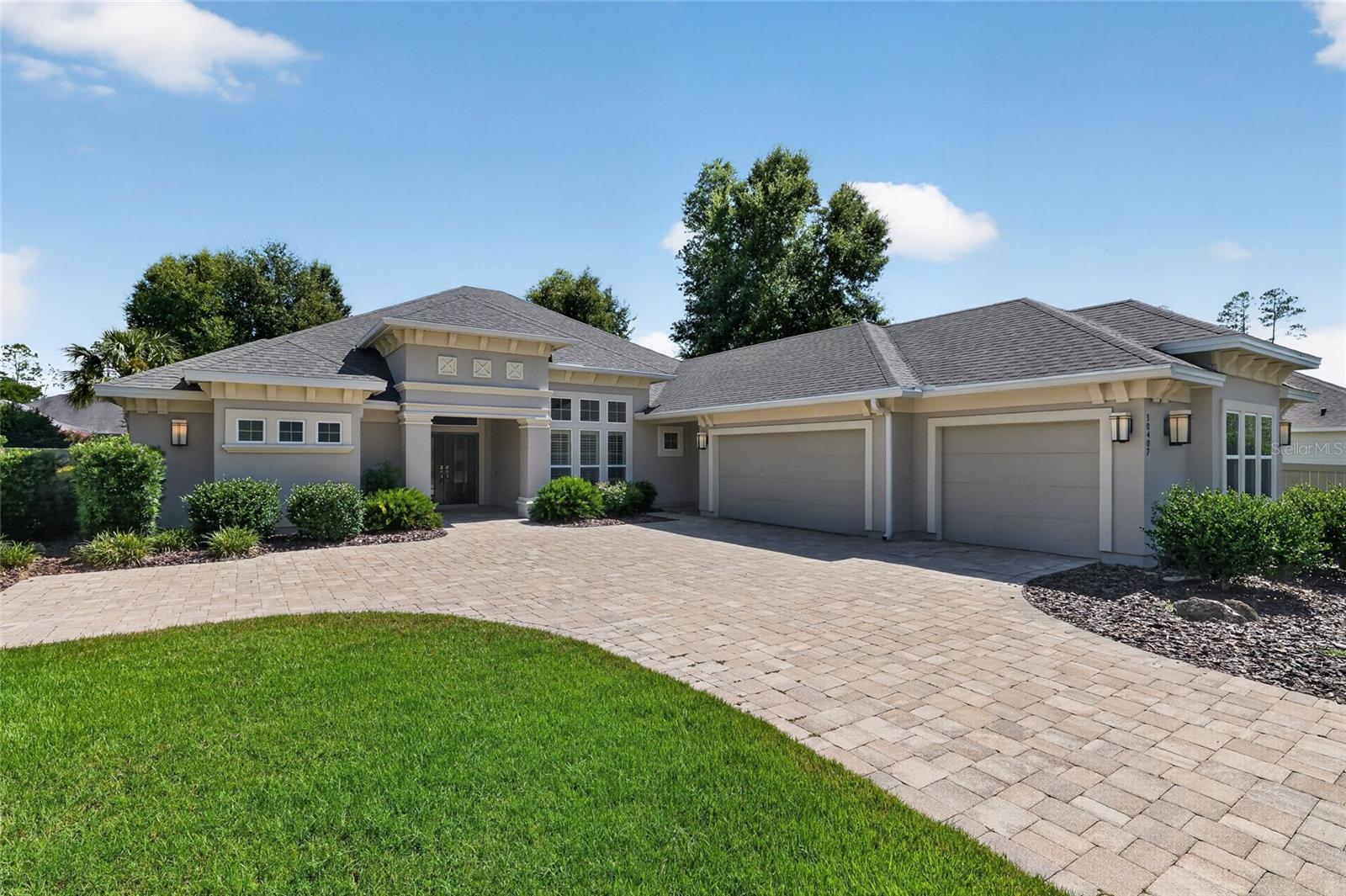 Virtually Staged. Just bring your belongings and start enjoying our Florida lifestyle. This exceptional custom pool home in the sought-after Estates of Wilds Plantation offers 3,583 SF of impeccably designed living space, where refined craftsmanship and effortless FL living come together perfectly. Beautifully appointed, every detail reflects a commitment to quality and comfort. The versatility of this floor plan is one of Tommy Waters Custom Homes' most sought-after modern transitional designs, featuring 5 bedrooms (use your 5th bedroom as a spacious bonus room, media room or game room) and 4 baths. The separate study, with convenient access to a full bath, also offers the ideal opportunity for a 6th bedroom. The chef's kitchen serves as the heart of the home, featuring custom handcrafted floor to ceiling height wood cabinetry, granite countertops, premium finishes, a center prep island, an “L” shape raised breakfast bar for seating for 8, a pantry, and high end appliances, including a 5-burner gas cooktop with 9 cabinetry doors underneath for easy storage solutions, and a built-in Miele whole bean coffee system that delivers espressos, cappuccinos, lattes or regular coffee. In short, the kitchen is perfectly designed for everything from daily meals to large gatherings. Adjacent to the kitchen is the dining space complete with dry bar, display shelving, upper and lower cabinets, and beverage cooler. The luxurious primary suite offers a retreat with refined finishes and an atmosphere of quiet relaxation with its separate sitting area overlooking the pool, spa, and lanai. Each closet is outfitted with closet organizational systems. The en suite bath has a separate soaking tub and water closet. Further, there are dual vanities and a spacious walk-in shower. GUEST accommodations are flexible to your needs….3 guest rooms with a bonus room and separate office **OR** 4 guest rooms with a separate bonus room/office **OR** 5 guest rooms, all while maintaining comfort for family and visitors alike. All baths have quartz counters. Additional upgrades include wood-look porcelain tile flooring throughout the main living areas, the separate office and separate bonus room – mimicking the appearance of natural hardwood planks in these rooms. The 468 SF paver lanai is designed for year-round enjoyment, with a fully equipped summer kitchen with grill, exhaust hood, quartz countertop topping the lower storage cabinets, and a beverage cooler. The saltwater pool and gas heated spa are the lanai’s focal points. Use the pool for fun and play **OR** turn on the propulsion jets for your endless pool, generating a smooth, adjustable river-like turbulence-free flow, without the need for flip turns, ideal for swimming in place, rigorous training or aquatic therapy. The fully fenced rear yard offers just under a 1/10th of an acre of space for fun and play. With over 35ft of depth and 110ft wide in the rear yard alone, this overall .45-arce lot faces south for the optimum sun-directionality for your pool and yard, perfect for starting your backyard food garden. Beautifully crafted and thoughtfully engineered, this home also offers exceptional energy efficiency with 6.54KW solar panels with battery backup, a Carrier multi-zone HVAC system, Low-E insulated windows and transoms, and dual tankless water heaters. Completing the package is a full-size laundry room, separate side entrance door, a custom stop-n-drop, fresh exterior paint, and a 3-car side entry garage with paver driveway.