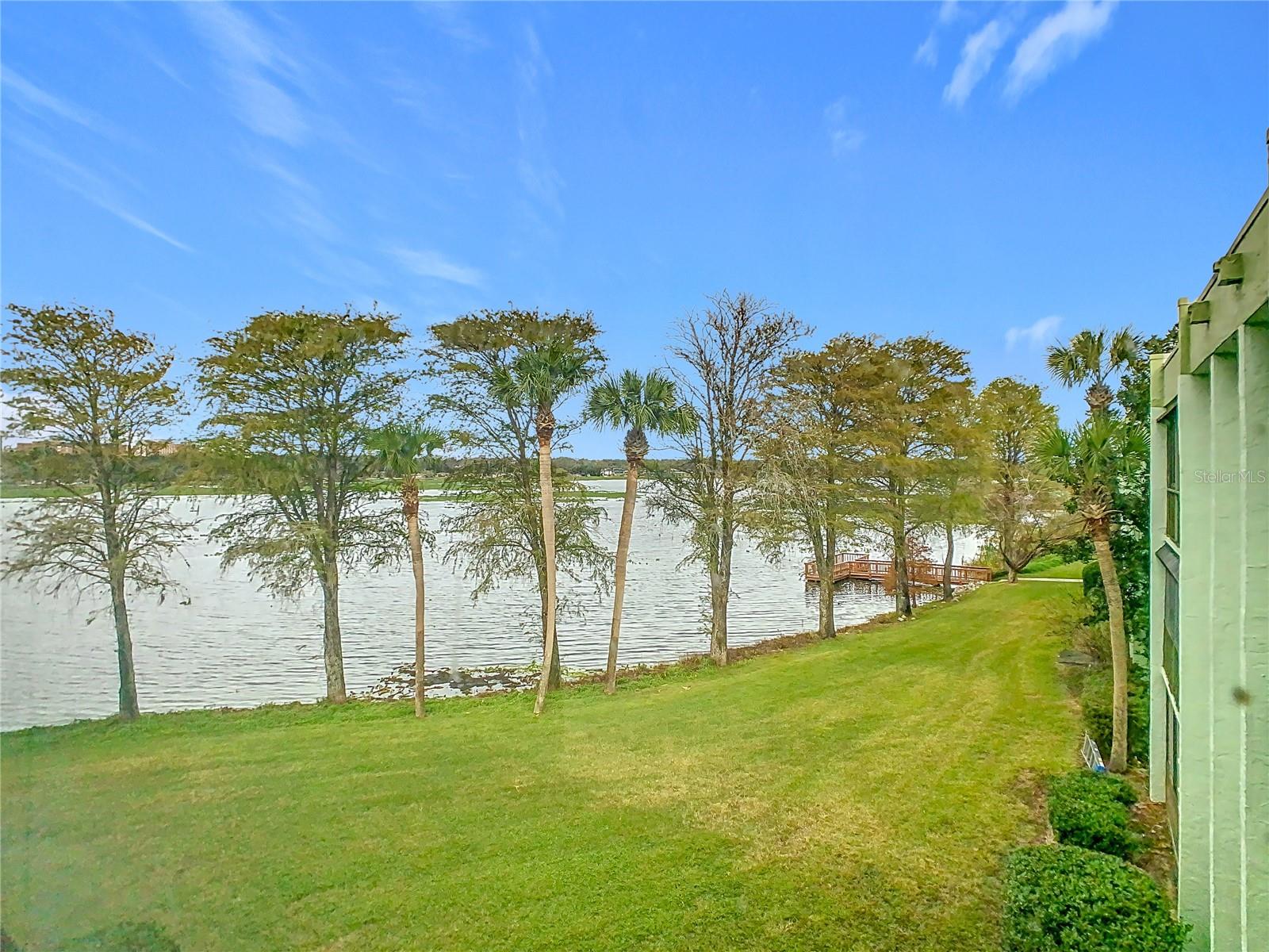 YOUR RETIREMENT DREAM STARTS HERE. Imagine waking up every morning to peaceful water views with absolutely nothing on your to-do list, because someone else handles the maintenance. That’s exactly the life waiting for you at Lakeside Village. This building is tucked away in the back of the community, perfectly positioned right on the lake. Inside you’ll find a one-bedroom, one-and-a-half-bath condo with laminate flooring and a practical kitchen with all appliances included. Right off the kitchen there’s a dedicated laundry room, which is one of those conveniences you really appreciate. The unit is clean, move-in ready and sits on the top floor, with elevator access, so getting there is never a hassle. The primary suite has a spacious walk-in closet and a full bath with a tub/shower, and a separate half bath keeps things comfortable when guests come to visit. The real draw though is stepping into the enclosed screened lanai and taking in that water view. Morning coffee is a whole different experience when you’re looking out at the lake, and sunsets are spectacular. The community itself gives you plenty to do without ever feeling like you have to. There’s a dock for fishing, tennis courts and a swimming pool, as well as a fenced-in dog walk area. And the HOA dues cover water, sewer, cable TV, internet and exterior maintenance, so monthly costs are straightforward. Beyond the community gates, Lakeland itself is a genuinely great place to land. It’s a thriving city with an abundance of shopping, dining and entertainment, and the historic downtown has a charm that’s hard not to love. You’re right in the heart of Central Florida, so the beaches are an easy drive and everything Tampa and Orlando have to offer is practically in your backyard. And if you’re a snowbird, this affordable condo makes a lot of sense. When it’s time to head home for the summer, locking up and leaving is simple. Just close the door and go. Come take a look. You’ll get it the moment you arrive.
