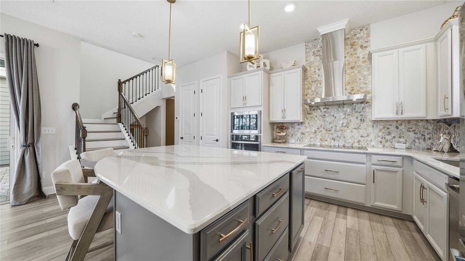 Built in 2020, this beautifully maintained 3 bedroom, 2.5 bathroom home offers a perfect blend of modern design, comfort, and everyday functionality in a highly convenient Jacksonville location. The main level features an open concept layout with abundant natural light, creating a bright and inviting space ideal for both relaxing and entertaining. Luxury vinyl plank flooring runs throughout the downstairs, leading into a well appointed chef’s kitchen complete with a large center island, ample cabinetry, and plenty of prep space for hosting family and friends. Just off the main living area, the private courtyard creates a seamless indoor outdoor flow and is perfect for entertaining, grilling, or simply enjoying a quiet evening at home. A convenient half bath is located on the first floor, along with a thoughtfully designed drop zone/mudroom just off the oversized two car garage, making daily routines seamless.
Upstairs, a spacious loft provides flexible living space that can be used as a home office, media room, or play area. The split bedroom floor plan offers added privacy, with a generously sized primary suite featuring a comfortable sitting area, double vanity bathroom, and a large walk-in closet. The secondary bedrooms are well sized and share a full bathroom, while the upstairs laundry room adds an extra layer of convenience to everyday living.
Situated in a gated community with a resort style pool and lawn maintenance included, this home offers a low maintenance lifestyle in one of Jacksonville’s most accessible areas. You’re just 5 minutes to I-295 and less than 10 minutes to St. Johns Town Center, Costco, and a wide variety of shopping, dining, and entertainment options, making this location hard to beat.

All information pertaining to the property is deemed reliable, but not guaranteed. Information to be verified by the Buyer. Be advised that cameras may exist recording audio and video inside/outside the property, such as ring doorbells. Photos are digitally enhanced and could be altered, please verify.