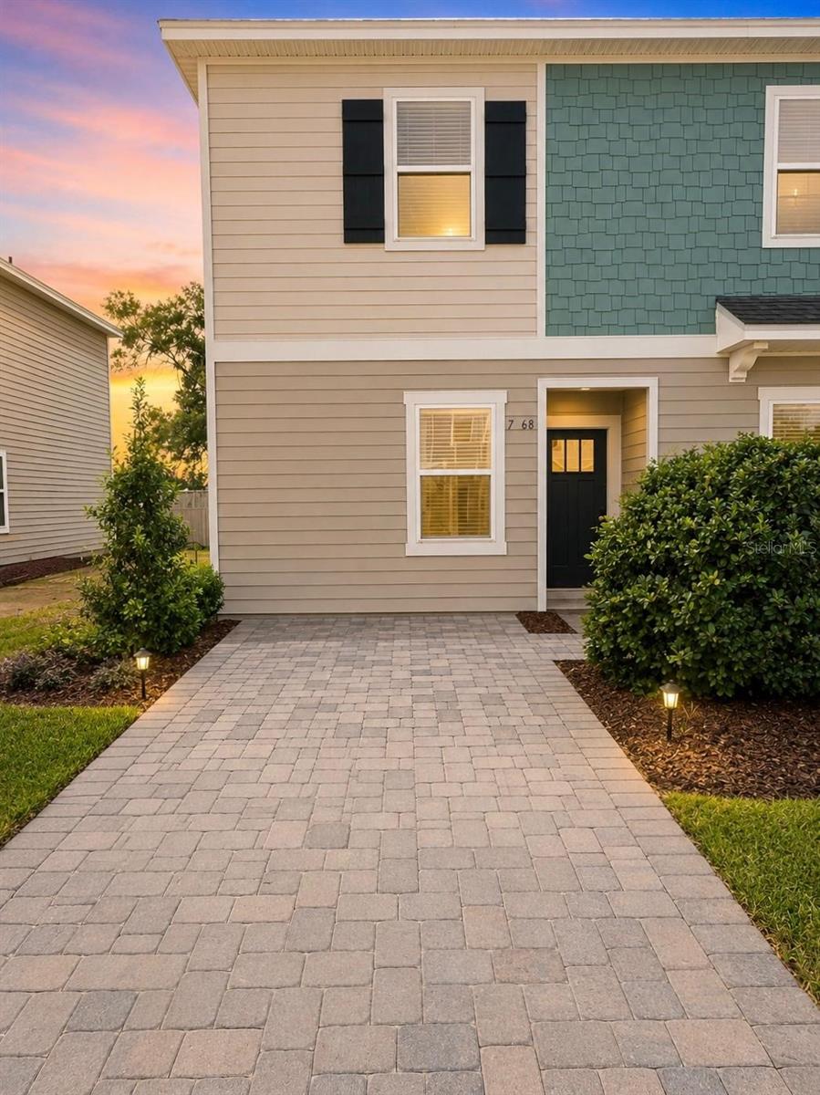 Experience modern luxury in this beautifully crafted 2026 end-unit townhome, located in Jacksonville’s intimate Sabal Terrace community. The highly desirable Rowan floor plan offers 1,180 sq. ft. of optimized, light-filled living space featuring 2 bedrooms and 2.5 bathrooms. The bright, open-concept main level boasts high ceilings, an inviting dining area, and a spacious great room that flows seamlessly into a beautifully appointed kitchen—complete with chic gray cabinets and a full GE appliance package, including the refrigerator.  Step outside to your private outdoor lanai, perfect for morning coffee or fresh-air relaxation. Upstairs, the tranquil primary suite serves as a true retreat, offering an en-suite bath and dual large closets. A secondary bedroom with its own full bath and a convenient upstairs laundry area, with washer and dryer included, complete the second floor. Whole-house blinds and a main-level powder room add everyday ease and thoughtful convenience.  Sabal Terrace offers an incredible lifestyle with low HOA dues, absolutely no CDD fees, picturesque lake and preserved wetland views, and a planned National Wildlife Federation-certified monarch butterfly garden. Ideally located near I-295, I-10, and everyday conveniences, this pristine home blends comfort and location perfectly. Schedule your private showing today! Staged photos, Home is unfurnished.