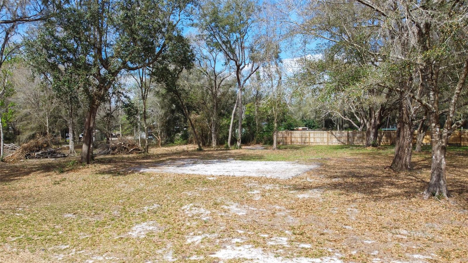 Escape to a quiet corner of Sumter County with this prime quarter-acre homesite (Parcel S15A216). This isn't just a plot of land; it’s a rare opportunity to bypass the "fixer-upper" headache and start with a clean slate. Whether you’re dreaming of a contemporary custom residence or a secluded weekend getaway, this property offers the perfect balance of privacy and accessibility.
The groundwork for your new build is already simplified thanks to recently upgraded roads and electricity utilities with completed engineering servicing the street. You can also move forward with confidence knowing the immediate area features proven success for installing standard septic systems and drilling reliable wells.
Ownership also unlocks a fantastic local lifestyle. Buying this property grants you exclusive, private access to the neighborhood lake, and you are just minutes from a local County Park packed with amenities like a boat ramp and barbecue facilities. 
Your custom-built future starts here.