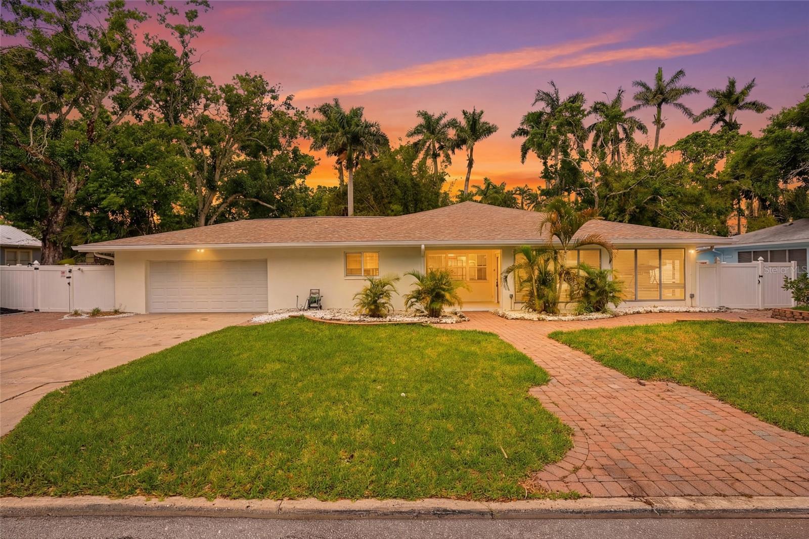 Welcome to 2004 Virginia Drive in Bradenton - a beautifully updated home just a short walk from the Village of the Arts, downtown, the Marina District, and the scenic Riverwalk, offering the best of Florida living. This spacious residence features over 2,700 square feet of thoughtfully designed living space filled with natural light and modern, organic finishes throughout. A charming front sunroom greets you, perfect for morning coffee, while impact-rated windows, an updated HVAC system, and a 2021 roof provide comfort, irrigation for the lawn, and new insulation in the attic for peace of mind. The split floor plan offers a private primary suite with a walk-in closet and en-suite bath with dual sinks, while two additional bedrooms are located on the opposite side. A second rear sunroom adds flexibility for a fourth bedroom, office, or bonus space. Outside, enjoy a fully fenced backyard with lush native landscaping and room for a pool, along with a two-car garage, ample storage, and plenty of parking for guests, boats, or recreational vehicles. Boating enthusiasts will appreciate rare riparian rights with Gulf access, including approximately 12 deeded feet of waterfront on Warner Bayou with depths ranging from 4 to 10 feet and direct access to the Manatee River and Gulf of Mexico, with potential for a dock or lift (buyer to verify). Ideally located near top-rated schools, shopping, dining, Robinson Preserve, Fort De Soto Park, and the beaches of Anna Maria Island, this home also offers easy access to downtown Bradenton and I-75 - schedule your private tour today to experience everything this exceptional property has to offer!!