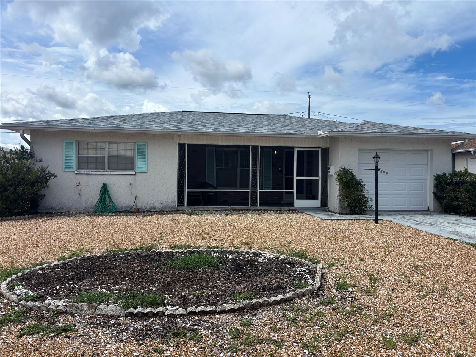 Don’t miss this great opportunity for a first-time buyer or Savy Investor. This home features living room, dining room and kitchen, front screened porch, enclosed rear lanai with heat and air, 2 bedrooms and a bath as well as a garage with laundry and a second bath (shower, toilet and utility sink in the rear of garage with great potential). New roof completed in June 2025 for your peace of mind. A/C is original. Located in a convenient area close to shopping, restaurants, schools, and Houses of Worship. With some updates, this could be a wonderful home for someone to make their own. Home is being sold completely "As Is". Don't wait opportunity is knocking!
