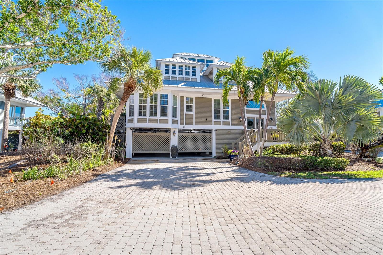 Charming Seawatch Home – Beachside Elegance in Boca Grande
Discover the ultimate in coastal luxury with this beautifully appointed 3-bedroom, 3-bathroom home in the exclusive gated beachfront community of Seawatch on Boca Grande. Set along 1,000 feet of pristine, private Gulf-front shoreline, Seawatch offers an unparalleled island lifestyle with two community pools, three tennis courts, and lush tropical landscaping—all just minutes from Boca Grande’s charming village.
Designed with both elegance and comfort in mind, this residence features a bright, open floor plan with soaring cathedral ceilings and panoramic water views from nearly every room. The spacious master suite serves as a serene retreat, offering a private balcony overlooking the Gulf, two walk-in closets, and a spa-like bath with dual vanities, a soaking tub, separate shower, and private water closet. Two additional bedrooms provide ideal accommodations for family and guests, including one with its own ensuite bath for added privacy.
This home has been thoughtfully updated for modern coastal living with high-impact windows, a durable standing seam metal roof, ultraviolet (UAV) air purification system, whole-home surge protection, upgraded electrical, and a complete water treatment system, ensuring comfort, safety, and peace of mind.
Enjoy peaceful moments in the top-level Seawatch, where you can savor morning coffee at sunrise or take in the breathtaking Gulf sunsets. A cozy loft area provides the perfect spot for a home office, reading nook, or quiet retreat surrounded by island beauty. The screened lanai invites you to relax and unwind while enjoying gentle sea breezes and tranquil water views.
Practical features complement the home’s elegance, including a spacious lower-level garage and workshop—perfect for vehicles, golf carts, and beach gear. From this ideal location, you’re just moments away from Boca Grande’s boutique shops, fine dining, biking and walking paths, and world-class beaches.
Don’t miss this rare opportunity to own a piece of paradise in one of Boca Grande’s most coveted communities. Experience Seawatch—where luxury meets the laid-back rhythm of island life.