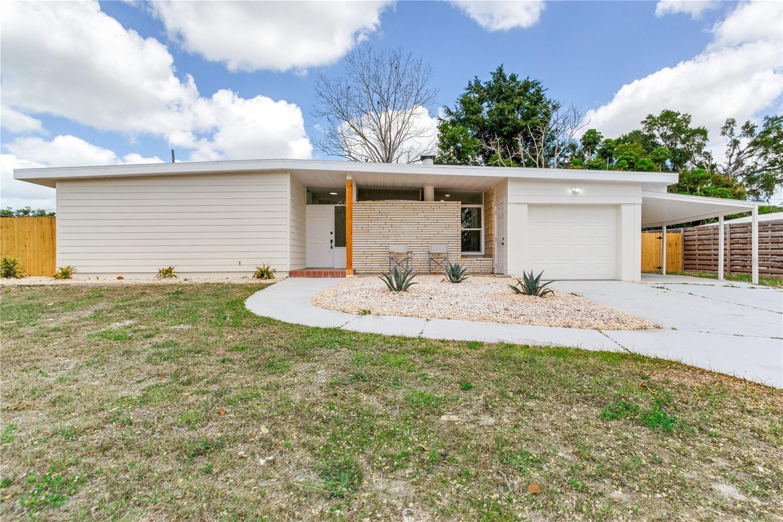 Welcome to 2753 Valencia Drive, a beautifully reimagined 2-bedroom, 2-bath residence offering 1,541 square feet of light-filled living in the heart of Sarasota. From the moment you arrive, the home’s clean mid-century lines, fresh exterior finishes, and inviting covered entry set the tone for what’s inside.  Step through the front door into a bright, open living space where wide-plank flooring, recessed lighting, and a soft neutral palette create a warm yet modern feel. The spacious living room flows effortlessly into a secondary sitting area centered around a charming brick fireplace perfect for relaxing evenings or entertaining guests.  The fully renovated kitchen is both stylish and functional, featuring crisp white shaker cabinetry, quartz countertops, stainless steel appliances, designer backsplash, and elegant gold hardware accents. Thoughtful details and ample storage make this space as practical as it is beautiful.  Just beyond, a sun-drenched dining area is surrounded by large windows that bring the outdoors in, creating the perfect setting for morning coffee or intimate dinners while overlooking the private backyard.  Both bathrooms have been tastefully updated with modern vanities, upgraded fixtures, and clean, timeless finishes. The bedrooms are generously sized, offering comfort and flexibility for guests, a home office, or everyday living.  Step outside to a spacious backyard with room to create your own outdoor oasis whether it’s a pool, garden, or entertaining space. The covered patio adds even more versatility for year-round enjoyment.  Ideally located in one of Sarasota’s most desirable areas, this home places you just minutes from downtown Sarasota, Siesta Key Beach, shopping, dining, and top-rated schools.  This is a rare opportunity to own a move-in-ready home that perfectly blends modern updates with timeless charm your Florida lifestyle starts here.