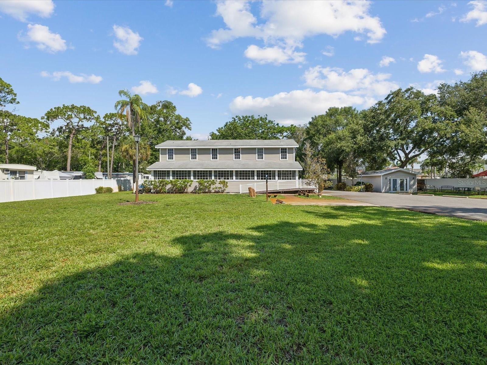 Seller is offering a $30,000 concession toward roof replacement and lower level flooring updates, giving buyers the flexibility to customize these improvements to their own style and needs.  Located in the heart of highly desirable Safety Harbor, this unique property is just minutes from the charming downtown district featuring award-winning restaurants, boutique shopping, local pubs, parks, the public library, wellness spas, lodging, and the renowned Safety Harbor Resort & Spa. Situated on nearly one acre and zoned R-3, this versatile property presents an exceptional opportunity for investors, developers, business owners, or those seeking a private multi-use compound.

Formerly operated as an Assisted Living Facility and approved for 19 beds, the 3,825-square-foot main building offers a functional and well-designed layout. The interior features 12 bedrooms (5 downstairs and 7 upstairs), 5 bathrooms with both private and hallway access, a spacious living room, formal dining area, full kitchen, laundry room, and a bright enclosed porch filled with natural light.

Notable features include:
• Elevator
• Whole-house fire sprinkler system
• Two HVAC systems and two water heaters
• Vulcan natural gas stove
• Washer, dryer, and commercial food-storage refrigerators included
• Generator
• Walk-in food storage shed and additional large utility shed
• Detached secondary structure ideal for an office.
• Ample parking
• No HOA or deed restrictions

The expansive 0.95-acre lot (199 feet of frontage by 207 feet deep) provides endless possibilities, including room for a pool, additional residence, or future expansion. Located in Flood Zone X, no flood insurance is required.

Permitted uses include Assisted Living Facility, Congregate Care Facility, Community Residential Home, Day Care, Church, Public Education Facility, Multifamily Residence, Two-Family Dwellings, and a variety of private compound opportunities.

Floor plans are available in the photo gallery.