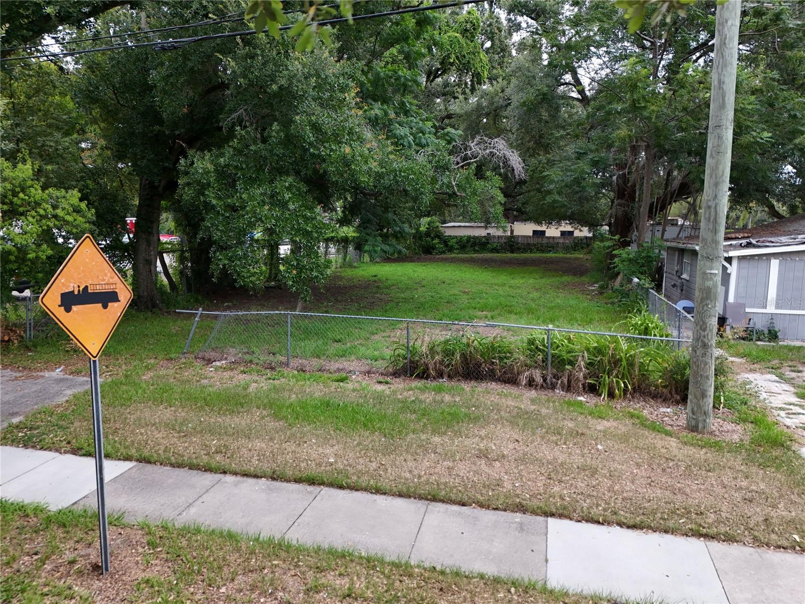Virtually Staged. Vacant cleared lot opportunity near Downtown Orlando! Located at 1413 29th St, Orlando, FL 32805, this cleared lot is ideal for investors, builders, or buyers looking to build in a growing Orlando area. Conveniently located near Camping World Stadium, Inter&Co Stadium, Kia Center, downtown entertainment and dining. Easy access to major roadways including I-4, SR-408, Orange Blossom Trail/US-441, John Young Parkway, and Colonial Drive/SR-50, providing convenient connectivity throughout Central Florida. Great potential for future development or long-term investment. Buyer and buyer’s agent to verify zoning, building requirements, utilities, setbacks, impact fees, lot dimensions, and intended use.
