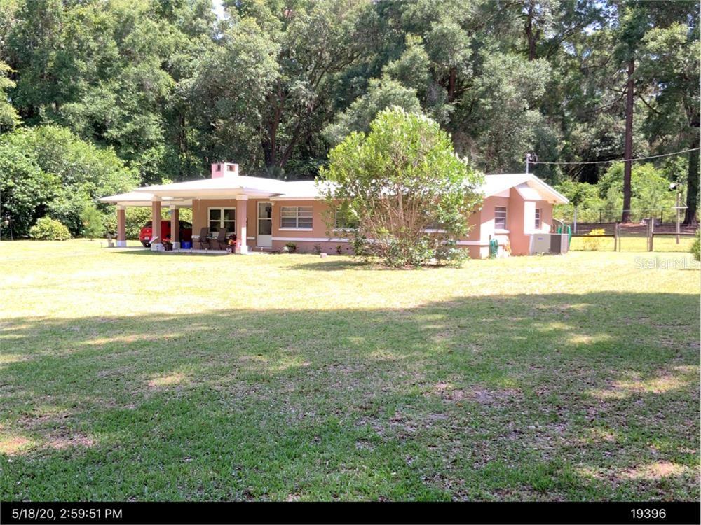 Now offered at $569,000 with possible seller financing available, this rare Jonesville property is ideal for buyers searching for space, flexibility, and a more creative path to ownership. Set on 3.45 acres with no HOA, this property offers privacy, infrastructure, and long-term potential in one of the most convenient locations west of Gainesville.

The sellers are open to discussing owner financing on a portion of the purchase price, which may give qualified buyers an alternative to traditional financing. Possible terms may include seller financing approximately 30% to 40% of the purchase price at 6% interest for 10 years, with final terms subject to negotiation, seller approval, and buyer qualification. Creative ideas are welcome.

Beyond the financing opportunity, this property stands out for its setup. The concrete block home sits beneath beautiful live oaks and features classic terrazzo floors, a durable metal roof, a wood-burning fireplace, and an updated kitchen with granite countertops, custom cabinetry, and newer stainless steel appliances. It has the warmth, character, and solid construction buyers love, with room to make it your own.

What makes this property especially unique is the existing infrastructure already in place: two wells, two septic tanks, and two separate utility connections. This creates exciting possibilities for multigenerational living, guest quarters, a future second residence, workshop space, home-based business needs, or flexible future use. There may also be subdivision or additional homesite potential, subject to buyer verification with Alachua County building and zoning.

A major bonus is the four-bay concrete block garage located near the front of the property, close to the second well, septic, and separate active utility service. Whether you need space for vehicles, equipment, storage, hobbies, or future conversion ideas, this structure adds serious value and versatility.

Owned by the same family for more than 50 years, this property offers a rare combination of acreage, infrastructure, charm, and opportunity. Enjoy Clay Electric, no HOA, quick access to CR 241, and Publix just minutes away. Whether you are looking for land, privacy, multigenerational options, investment potential, or a creative financing opportunity, this Jonesville property deserves a closer look.