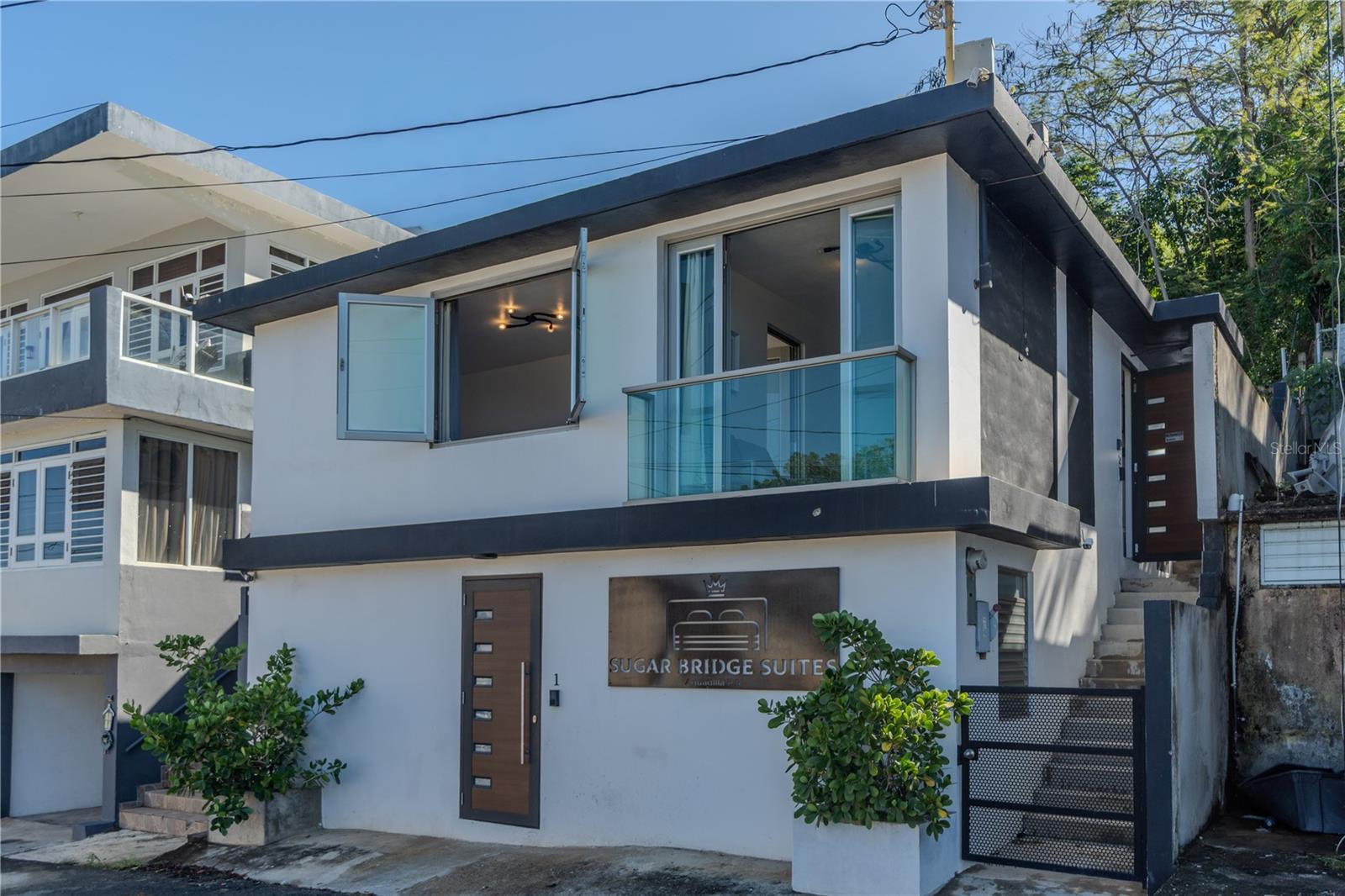 Located in Barrio Borinquen, Aguadilla, directly across from the iconic sugar pier, this ocean-view multi-unit property delivers both proven income and a clear path to increased returns.

The property consists of three independent units:

Unit 1:  2-bedroom, 1-bath (sleep 4)

Unit 2:  2-bedroom, 1-bath (sleep 4)

Unit 3: One 1-bedroom, 1-bath (sleep 4)

Each unit accommodates up to four guests, allowing for a diversified and optimized rental strategy across short-term, mid-term, and private bookings.

Currently generating approximately $65,000+ in annual net income, with the potential to increase.

A dedicated laundry room supports efficient operations, while property lot is 177.38 square meters that creates a clear opportunity to add value through amenities such as a pool, lounge, or wellness space.

This added value component allows investors to directly influence revenue growth, increase nightly rates, and enhance overall asset performance.



This is a high performing asset with built-in upside, designed for investors who understand value creation.



Positioned within a rapidly evolving coastal market, near Crash Boat Beach and Aguadilla’s expanding lifestyle and hospitality scene, this property offers both stability and scalability.

This is not just an income property.This is a growth driven investment.

Contact us for the investment package.