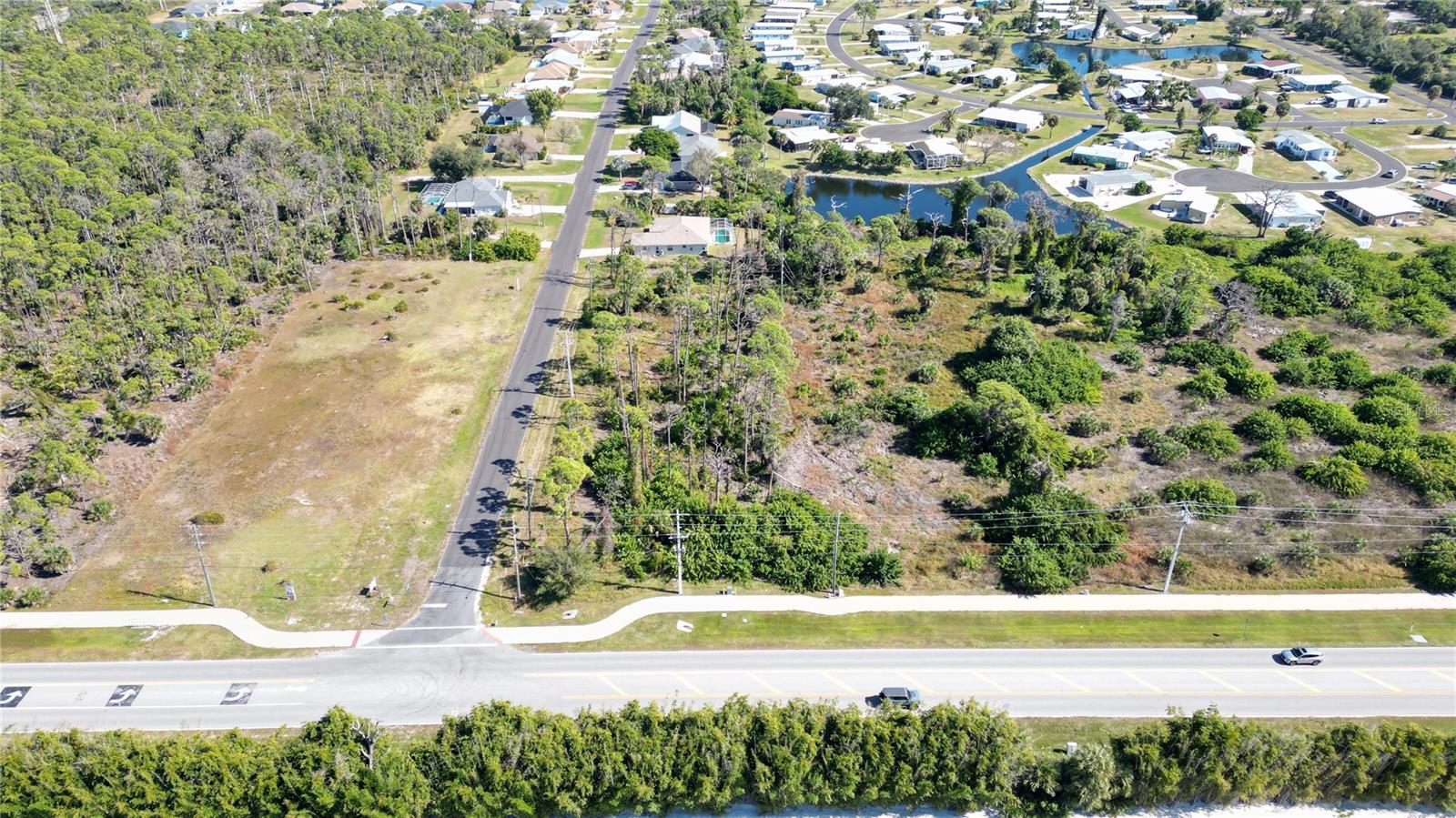 Ideally situated 0.95-acre commercial corner lot on Placida Road, serving as a key access point to the Lemon Bay Sound and Boca Grande area. Zoned CG (Commercial General), this high-visibility site (12,800 AADT) is perfect for a standalone retail, medical, or office building. 

Capitalize on the strong local demographics and coastal traffic flow. 

Looking to expand? This lot can be combined with the following adjacent parcels: 
6631 Placida Rd (Tract 1N): 2.94 Acres for $1,117,200 
6691 Placida Rd (Tract 1S): 4.00 Acres for $1,520,000