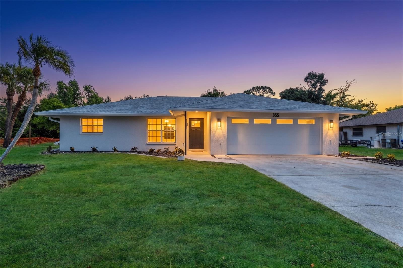 Virtually Staged. Located in the highly desirable South Venice area, this BEAUTIFULLY REMODELED 3-bedroom, 2-bath home with a 2-car garage offers 1,627 square feet of move-in-ready living space. Thoughtfully updated from top to bottom, this home showcases modern finishes, and stylish wood slat accent walls that create a seamless designer touch throughout the kitchen, dining area, primary bedroom, and en-suite bath. Step inside to an inviting open floor plan featuring luxury waterproof vinyl flooring throughout the main living areas and tile flooring in both bathrooms. The spacious living room flows seamlessly into the dining area, where French doors open to the lanai, creating the perfect indoor-outdoor living experience. The stunning kitchen is sure to impress with quartz countertops, subway tile backsplash, soft-close cabinetry, stainless steel appliances, under-cabinet lighting, a stylish wood slat accent wall, and a convenient pantry closet. The primary suite showcases a striking wood slat accent wall, a walk-in closet, and a beautifully updated en-suite bathroom featuring a modern vanity, LED frameless mirror, and a custom-tiled walk-in shower with sleek glass door, a soothing rain showerhead, a handheld wand, and a convenient storage niche. The second guest bedroom and guest bathroom are conveniently located on the same side of the home as the primary suite. The guest bath features a tiled shower/tub combination with a built-in niche, a single vanity, and an LED frameless mirror. The third bedroom is situated off the kitchen, providing flexibility for guests, a home office, or hobby space. Additional features include an inside laundry room with utility sink, and a storage closet to meet all your organizational needs. Step outside to the lanai, the perfect place to unwind after a long day with a glass of wine or entertain family and friends. Major Updates Completed in 2026: New electrical and plumbing throughout, New AC system with ductwork, Water heater, drywall and insulation, Interior and Exterior paint, light fixtures, doors and hardware, Well water softener and air injector system, Impact-rated front door and New garage door. In 2025: New roof, trusses, plywood, soffits, and gutters and well pump. Best of all, this property is not located in a flood zone, has no HOA, and no deed restrictions. Conveniently located near beautiful Gulf beaches, Historic Downtown Venice, shopping, dining, golf courses, Wellen Park, and so much more. Don’t miss this opportunity—schedule your private showing today!