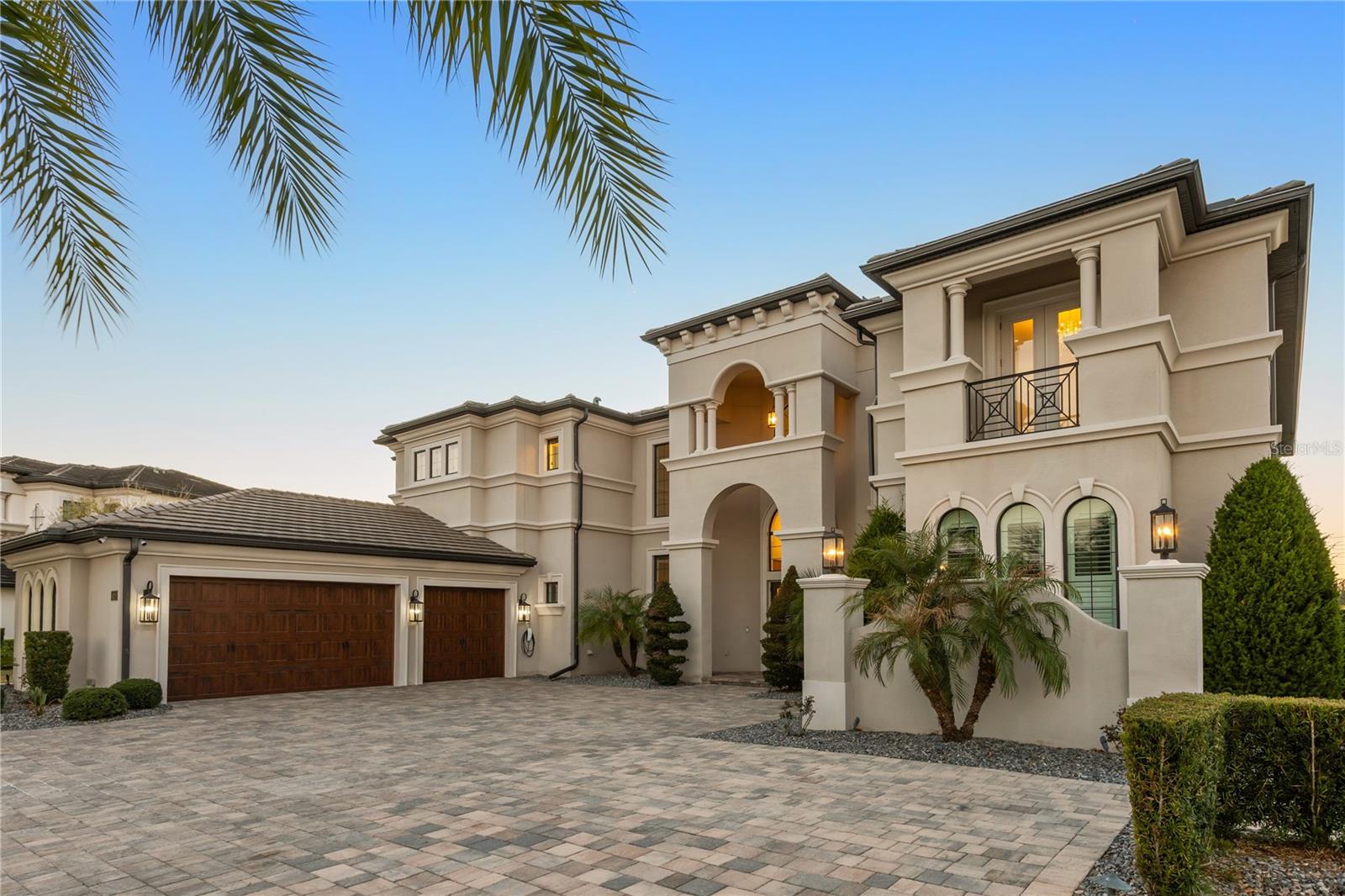 Experience an architectural masterpiece in the gated enclave of Casabella. Situated on a rare, oversized .85-acre lot, this estate has been transformed by the original owner with impeccable attention to detail. The interior features 6 beds, 6 full and 2 half baths, all the high-scratch-resistant flooring throughout the home comes in a beautiful white oak finish with bathrooms featuring porcelain floors and walls. Tech enthusiasts will marvel at the Lutron smart home system's ability to control power shades and lighting throughout the home. enterprise-grade 10Gbps networking backbone. Cinema lovers will find no equal in the custom movie theater, boasting a 133” anti-reflection screen, Sony 4K 3D projection, and a commercial-grade Dolby Atmos 11.2 3D sound system within a fully soundproofed environment. The backyard is a tropical paradise featuring imported African white marble flooring, a custom smart pool, and a professional Alfresco summer kitchen. The centerpiece is a magnificent 20,000-gallon Obsidian & Natural Stone Koi garden, fully equipped with UV/scrub filters and gas heating to protect its world-class inhabitants. Located minutes from top-rated Windermere schools, Orlando Health Central, and Dr. P. Phillips Hospital, with easy access to Downtown Orlando. This is not just a home; it is a high-tech fortress and a private resort