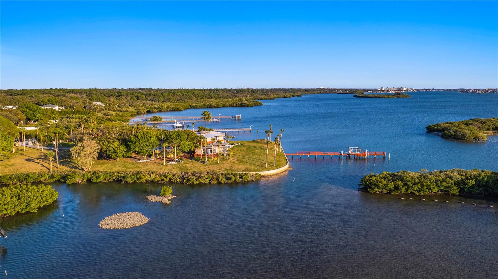 PRICE NOW REDUCED OVER  $2 MILLION – BEST WATERFRONT DEAL IN PINELLAS COUNTY; 850’+++ OF WATERFRONT ... TRULY a "One of a Kind" Estate-Site VALUE.... almost 2 acres of waterfront land - DIRECTLY overlooking the Intracoastal Waterway / Boca Ciega Bay with WIDE OPEN BAY VIEWS and a beautiful sunset exposure, for nightly panoramas ... PRICE REDUCED AGAIN FOR IMMEDIATE SALE ....
With this sized parcel of land, it’s like having your own subdivision … just IMAGINE – you will not be "ON the Cul-de-Sac" here ... No, you will OWN the ENTIRE CUL de SAC / Block!! … COMPARE this asking price (of JUST $38/Sq Ft, mol) to what OTHERS ARE PAYING for a “typical” 10,000 sq ft (or less) Lot /  “tear down house”  in the $1-$2M range (that is $150/sq ft @ $1.5 M for a10k sq foot lot) … recent closed-sale comps in Brightwaters area have ranged from  $167/sq ft to over $260/ sq foot; and btw $153-$177 sq ft on Clw Beach …. you’ll quickly  “SEE the VALUE” this lot brings … PLUS None have the Privacy Factor and WIDE-OPEN VIEWS of this parcel … (You could also possibly subdivide and sell off a lot one day … call for details) … and / or potentially build another home here, one day?? … 


you'll be essentially on your own PRIVATE ISLAND / PRIVATE PENINSULA … in your own “Gated Community” … with UNMATCHED PRIVACY … and LITERALLY NO NEXT DOOR NEIGHBORS on your LEFT OR your RIGHT side - JUST BAY VIEWS (and Bay Breezes)  ... this is a MUST SEE opportunity for the Well-Qualified and Discriminating Buyer, who values PRIVACY, FAMILY, LEGACY, and VALUE .. not to mention VIEWS and BOATING! … you’ll also get the ability to have an ADU in addition to your Main Home … AND the ability to use this as an Airbnb-type of vacation rental (subject to Pinellas County's regulations) should you so desire ...


Watch your Kids (or Grand Kids?) play FROM THEIR OWN FAMILY HOME, knowing they are Safe @ Home ...  LARGE DOCK with boat and double jet ski lifts …great for fishing and easy Intra-Coastal access for all of you Jet Skiers and boaters! … 180+ degree WATER VIEWS to the North and South - as well as Westerly, are sure to not only “please’, but to ENCHANT you and your Family & Guests all day and night! … …


This LOCATION is in a GREAT, Centrally Located part of Mid- Pinellas County, Tampa Bay – it’s about a 7-minute drive to The Beach and close to Seminole High School, and lots of shopping, restaurants and etc ... it's maybe a 40-minute drive to Tampa International Airport ...  This is a great option for a 1031-type Buyer as well ... SELLER will consider a Lease-Option with substantial down payment and will review an offer involving a split of property, THOUGH that is not a preference… Be SURE and watch the Drone Virtual Tour VIDEO as well as view ALL of the photos .. HURRY on this one!