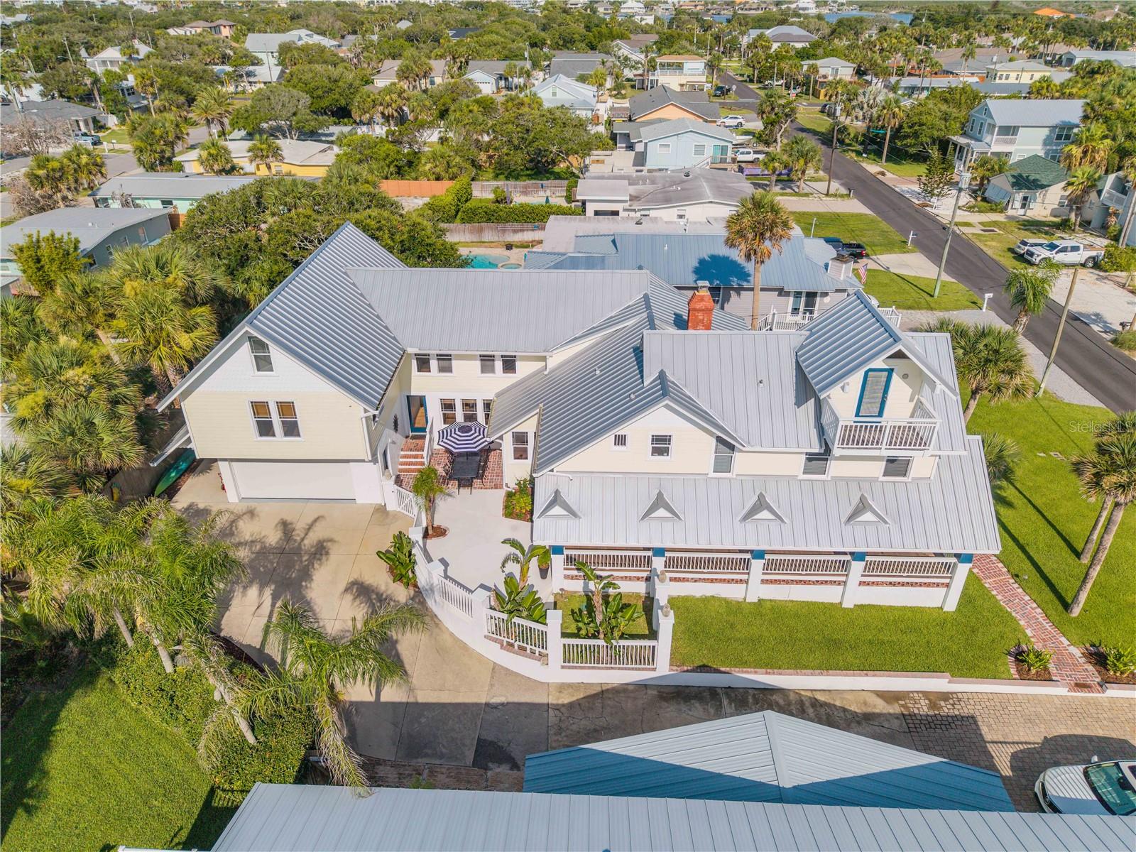 There are homes that tell a story—and then there are homes that preserve history.
Built in **1922**, two years before the official incorporation of Coronado Beach, **315 Due East Street** stands as one of the oldest and most significant original residences on the street. Constructed during Florida's celebrated 1920s land boom as a distinguished beachside estate for affluent winter residents, this remarkable property has endured for more than a century with extraordinary care. According to Volusia County property records, only **two owners** have served as its stewards, each preserving the home's architectural integrity and timeless character.
Rising across **four levels**, the residence offers **five bedrooms, four-and-a-half baths**, and an inviting blend of historic craftsmanship and thoughtful livability. Original hardwood pine ceilings, exposed beams, and authentic architectural details speak to an era when homes were built with permanence, artistry, and pride. Every room reflects the warmth and character that only a truly historic home can possess.
A private entrance apartment or in-law suite provides exceptional flexibility for multigenerational living, long-term guests, or income-producing opportunities while maintaining the privacy of the main residence. Throughout the home, generous living spaces and enduring design create an atmosphere equally suited for intimate family gatherings or elegant entertaining. Just moments from the Atlantic Ocean and the vibrant heart of New Smyrna Beach, this is far more than a coastal residence—it is a rare opportunity to own a meaningful piece of the area's history. Properties of this caliber seldom become available, offering not only architectural significance but the privilege of becoming the next steward of a landmark that has quietly witnessed more than a century of beachside life.
For the buyer who values authenticity, craftsmanship, and legacy, **315 Due East Street** is an offering unlike any other—a home where history is not simply remembered, but lived every day. Call for a private showing on this beautiful historic home. All information is deemed to be accurate. Buyers are responsible to verify all dimensions and other information deemed important to them.