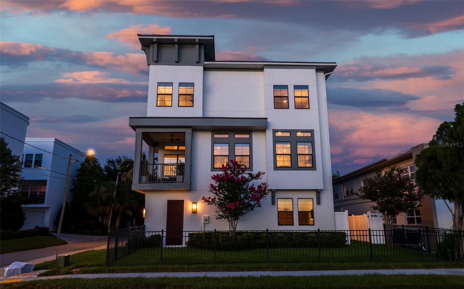 Newer construction, exquisite interior design, and attention to detail perfectly describe this rare unobstructed park view, water view and sunset view townhome overlooking Crescent Lake Park. Stepping out your front door provides access to paved walking/running paths around Crescent Lake, fishing, abundant green space, playground, pickleball, tennis, baseball, and dog parks not to mention steps to the 4th St N business corridor where you can find every commercial amenity that the city offers. Minutes to the Downtown St Pete District, Edge District, and Uptown District. This beautiful townhome is unique in that it boasts both a fenced side yard and a fenced rear patio perfect for entertaining or pets. The home is situation over three floors with an oversized two car garage as well as a guest suite on the first floor. The second floor boasts the main living space including a gourmet kitchen with large island and subway tile backsplash that extends to the ceiling as well as a walk-in pantry rounded out with a dining area, living room, and half bath. The third floor consists of the primary suite with two walk-in closets and spa-like ensuite bathroom. Across the landing is the second bedroom with ensuite bathroom and walk-in closet. The upstairs bedrooms are separated by a laundry room. As you tour each room, make sure you notice the water and park views from all rooms!! The west facing windows have been treated with 3M UV thermal protection and the bedroom blinds have blackout linings. Windows and doors are hurricane impact rated. Zoned, dual HVAC systems 2018, roof 2018, natural gas tankless water heater 2025, building exterior paint 2024, and the parking pad offers two additional parking spaces besides the garage accommodating four cars. Natural gas includes water heater, dryer, stove, and entry gas lamps. The HOA includes irrigation, lawn care/maintenance, pest management, master insurance policy, and biannual HVAC maintenance.