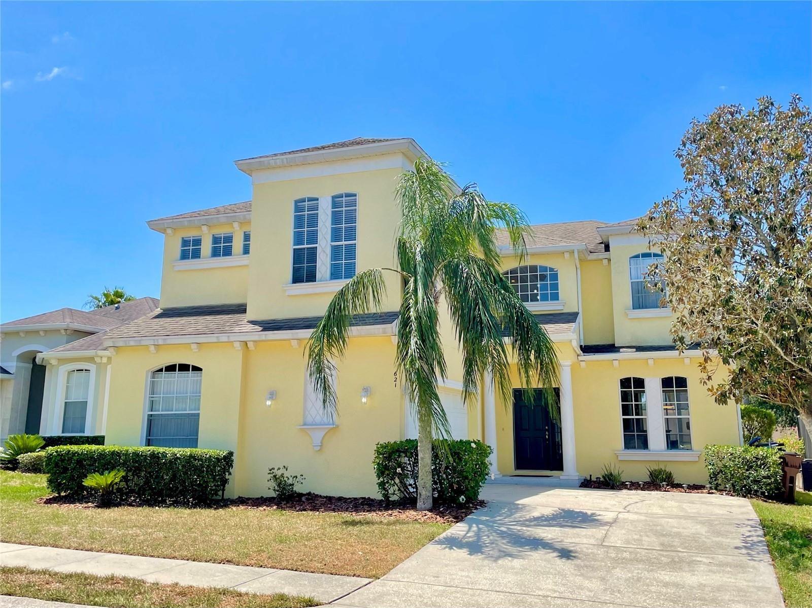 Showings start on Monday June 15,2026. Photos are of an unfurnished home. Sellers are living in the property. No CDD. Come see this open-floorplan home with pool and spa in a gated safe community. The community is called Calabay Parc at Tower Lake. The home can be a primary residence, family vacation home or short-term income rental. Featuring 5 BEDROOMS (including two primary suites, one on each floor), WITH A LOFT/BONUS ROOM, 4 FULL BATHROOMS, 2 HALF BATHROOMS (one of which is accessible directly from the pool/patio area) and a TWO-STORY LIVING ROOM/GREAT ROOM complete with a LARGE HEATED POOL and HOT TUB with an outside screen enclosure! The first floor is an excellent place to entertain, with the open floor plan that brings the kitchen, dining, and living room spaces into one large open area that flows from the front of the home all the way to the back, large sliding glass doors leading out to the large covered lanai with views of the pool and backyard. Ceramic floors with oversized tiles have been installed throughout the entire lower level of the home with luxury vinyl all upstairs. The kitchen features a NEW BUTLER PANTRY, NEW CABINETS in 2023, NEW APPLIANCES in 2023, and NEW MODERN LIGHTING FIXTURES AND NEW GARBAGE DISPOSAL. The lower level main bedroom suite features glass doors and a view of the pool as well as TWO CLOSETS, a large corner-style bathtub. CUSTOM MODERN HANDRAILS ON THE STAIRS. Loft space that could easily be used as an entertainment room, home office, den, play area, or additional bedroom. The second floor of the home is covered in VINYL FLOORING that stretches into the second primary bedroom suite, as well as the third, fourth and fifth bedrooms. Three full bathrooms are located on the upper level, with two in the hallway (one of which has access to the adjoining bedroom) and the third located in the UPPER LEVEL SUITE which also features a separate tub, shower, and closet. Two-car garage complete with finished floors and a level 2 EV CAR charger in the garage, BRAND NEW HVAC (2023) and a NEW ROOF and gutters 10/2024. NEW WATER HEATER IN 2024, NEW POOL AND SPA HEATER IN 12/2023, POOL RESURFACED IN 2024, NEW POOL PUMP MOTOR IN 2024. The community offers a gated guardhouse 24/7 at its entry, a PRIVATE BOAT RAMP AND DOCK right into Tower Lake, a community club house, and the HOA fee even INCLUDES LAWN/GROUNDSKEEPING for all residents!