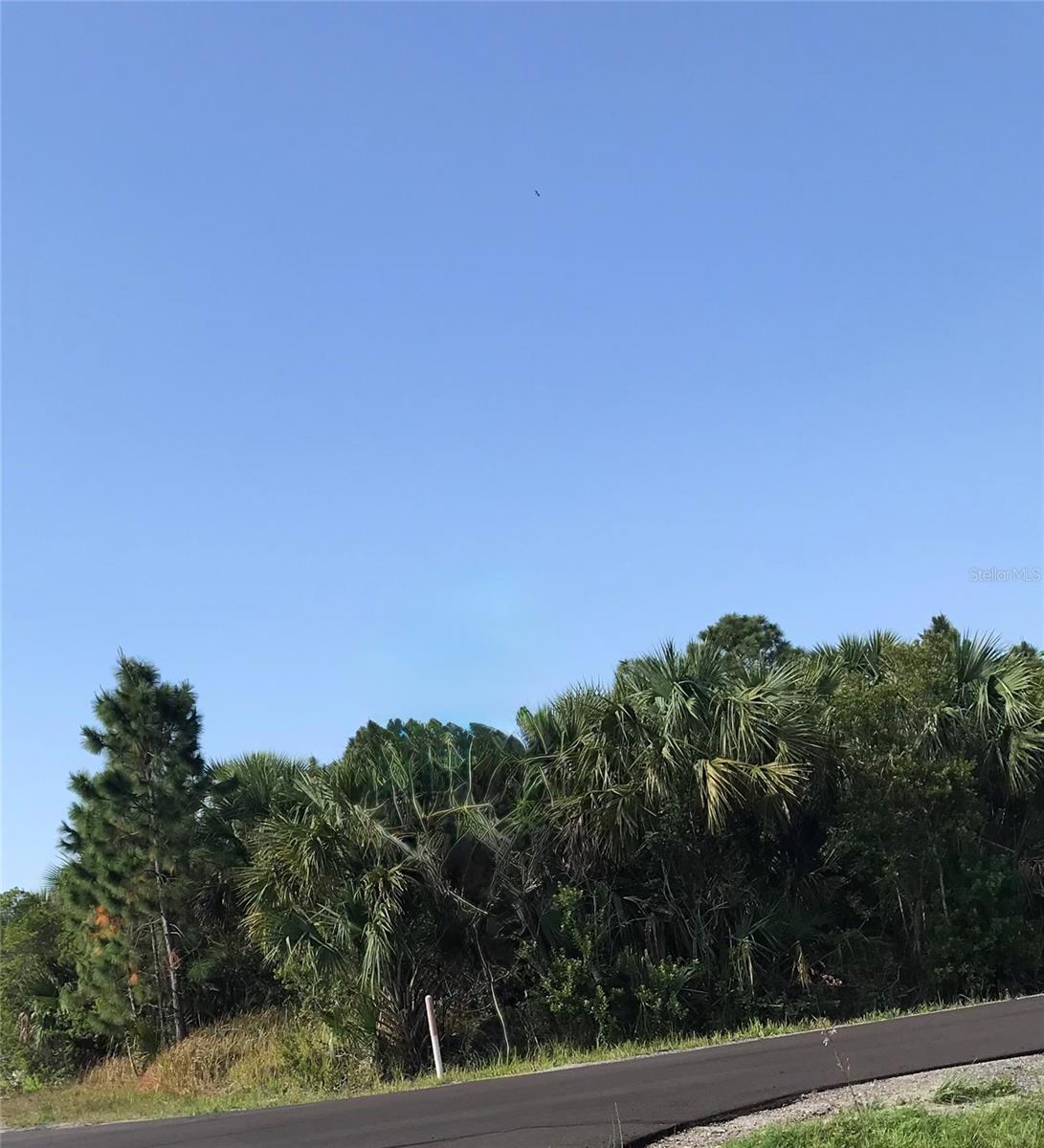 Excellent opportunity to own a residential homesite in the rapidly growing city of Palm Bay. This 0.23-acre lot offers the perfect setting for a custom home, spec build, or long-term investment. Located on a paved road and surrounded by ongoing development, the property provides convenient access to schools, shopping, dining, parks, and major commuter routes. No HOA. Secure your piece of Florida land today and take advantage of the area's continued growth. Buyer to verify zoning, utilities, environmental conditions, and future development plans.
