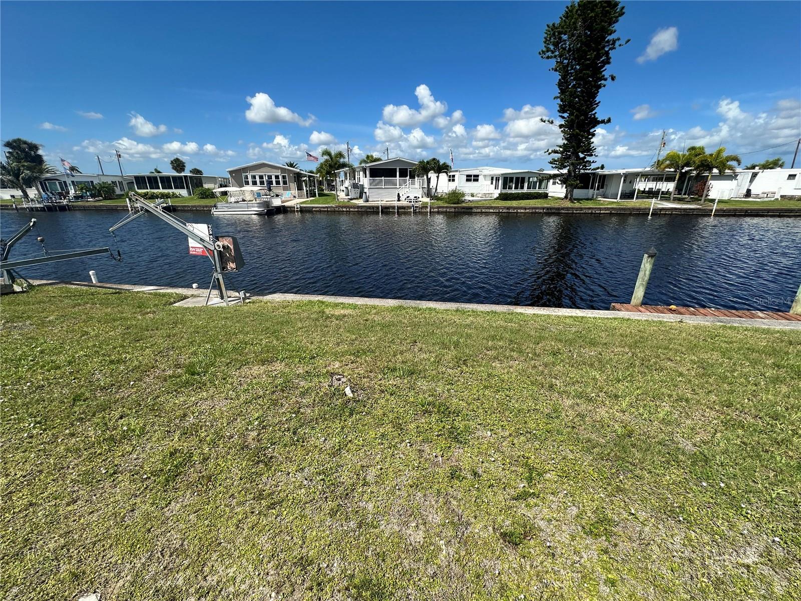 WATERFRONT Manufactured Home lot with concrete SEAWALL located in the active 55+ Harbor Cove Community. Harbor Cove is an active resident-owned WATERFRONT community with a clubhouse, two community pools, an exercise gym, shuffleboard & bocce ball courts, a wood workshop, a private marina, and TONS of resident social events to keep you active year-round! Conveniently located near US 41 for easy access to local shopping, dining, LIVE entertainment, and award-winning beaches. Schedule your private showing TODAY!