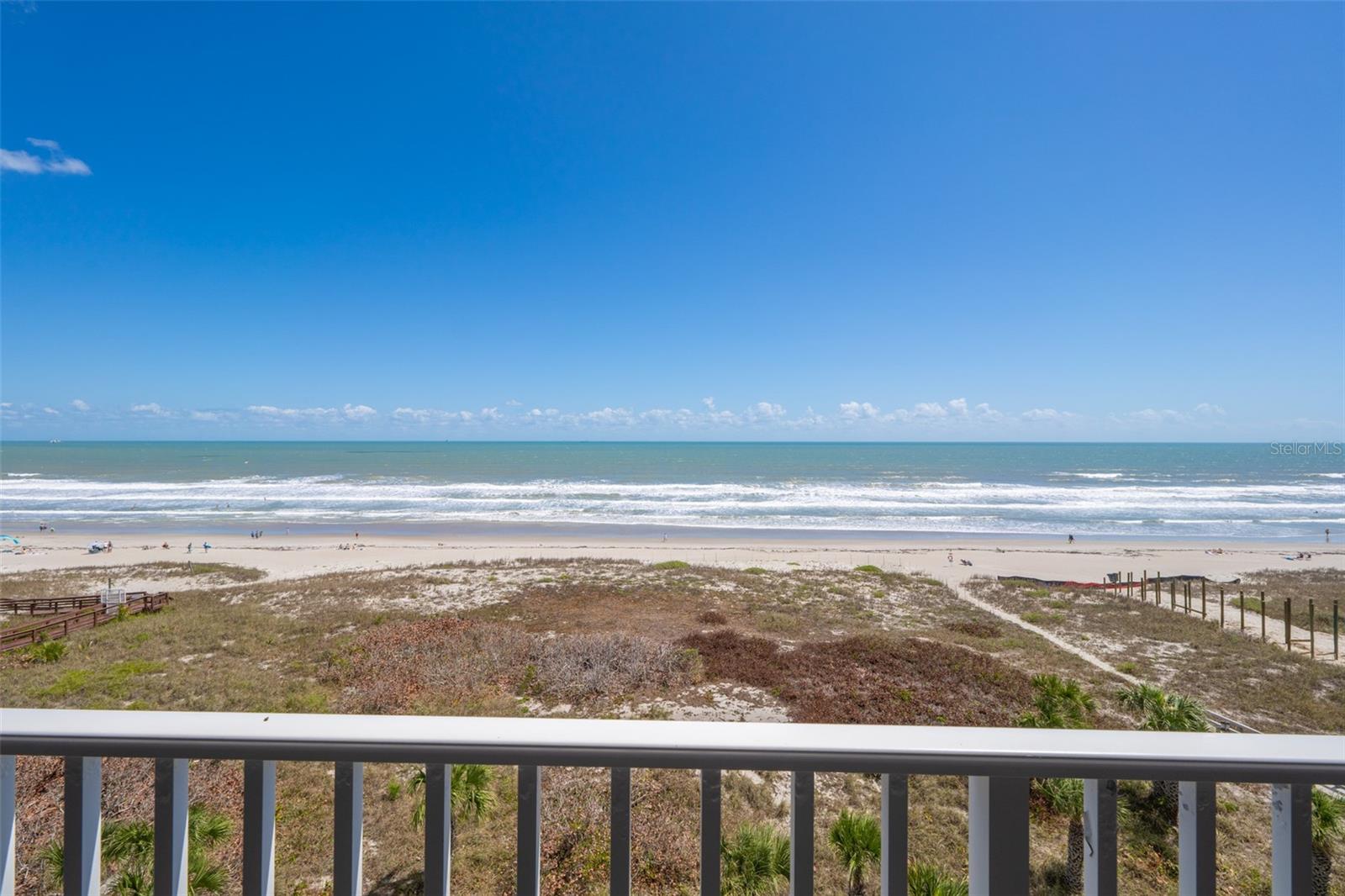 Welcome to Majestic Seas, where breathtaking OCEAN VIEWS are part of your daily routine. This FULLY-FURNISHED 2-bed, 2-bath coastal retreat on the 7th floor features an open living and dining layout with light tile flooring, floor-to-ceiling impact sliders with storm shutters, and a seamless flow to your expansive covered balcony patio, where you can relax and soak in ocean breezes. The eat-in kitchen features tile countertops, a decorative backsplash, breakfast bar, and stainless dishwasher. The primary suite is a true sanctuary with direct balcony access, wood-look laminate flooring, and a spacious en suite bath with jetted soaking tub and separate shower. A charming second bedroom with new laminate floors offers flexibility for guests. The welcoming entry foyer offers ocean views as you enter the home. An in-unit laundry room with built-in storage and assigned garage space adds everyday convenience.  Majestic Seas offers an impressive array of resort-style amenities designed for comfortable coastal living, including a resurfaced heated pool, updated clubhouse, fitness center, spa, and private beach access -- all within a well-maintained community. Residents also enjoy the convenience of an enclosed private garage with storage, guest parking, and even a car wash, with storm shutters providing added peace of mind. The location on Ocean Beach Blvd is equally compelling, placing you within a short walk of everyday essentials and just minutes from Cocoa Beach's most beloved landmarks -- the iconic Cocoa Beach Pier is only five minutes away, Ron Jon Surf Shop is a quick two-minute trip, and Port Canaveral is reachable in about ten minutes. For those needing to venture further, Orlando International Airport and world-class attractions are less than an hour away, making Majestic Seas the perfect blend of laid-back beachside living and everyday convenience. Beach life awaits!