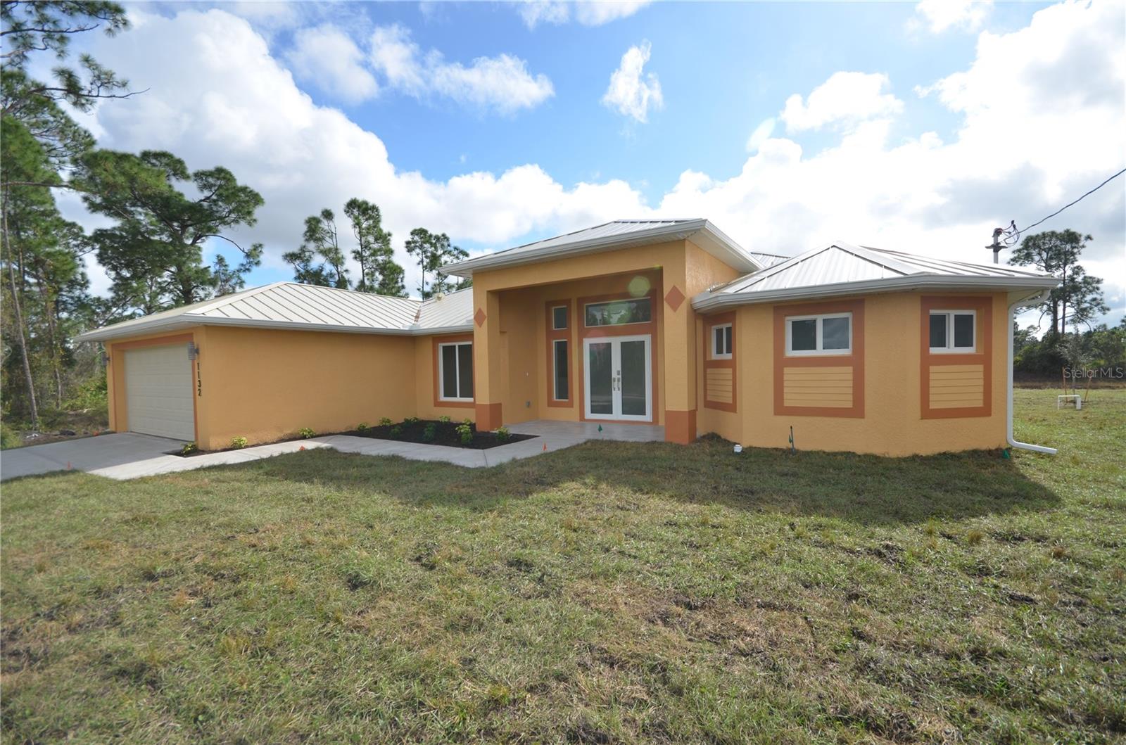 MODEL ABUNDANCE HOUSE: Welcome to your dream home in the heart of Lehigh Acres, FL! This stunning 2601 square foot residence, built in 2024, offers a perfect blend of modern design and functional living. Step inside to discover an expansive open-concept layout that seamlessly connects the living, dining, and kitchen areas, making it ideal for entertaining or simply enjoying your own space. The contemporary kitchen is equipped with top-of-the-line appliances, including a refrigerator, e-range, microwave, and dishwasher, ensuring that culinary adventures are a delight.