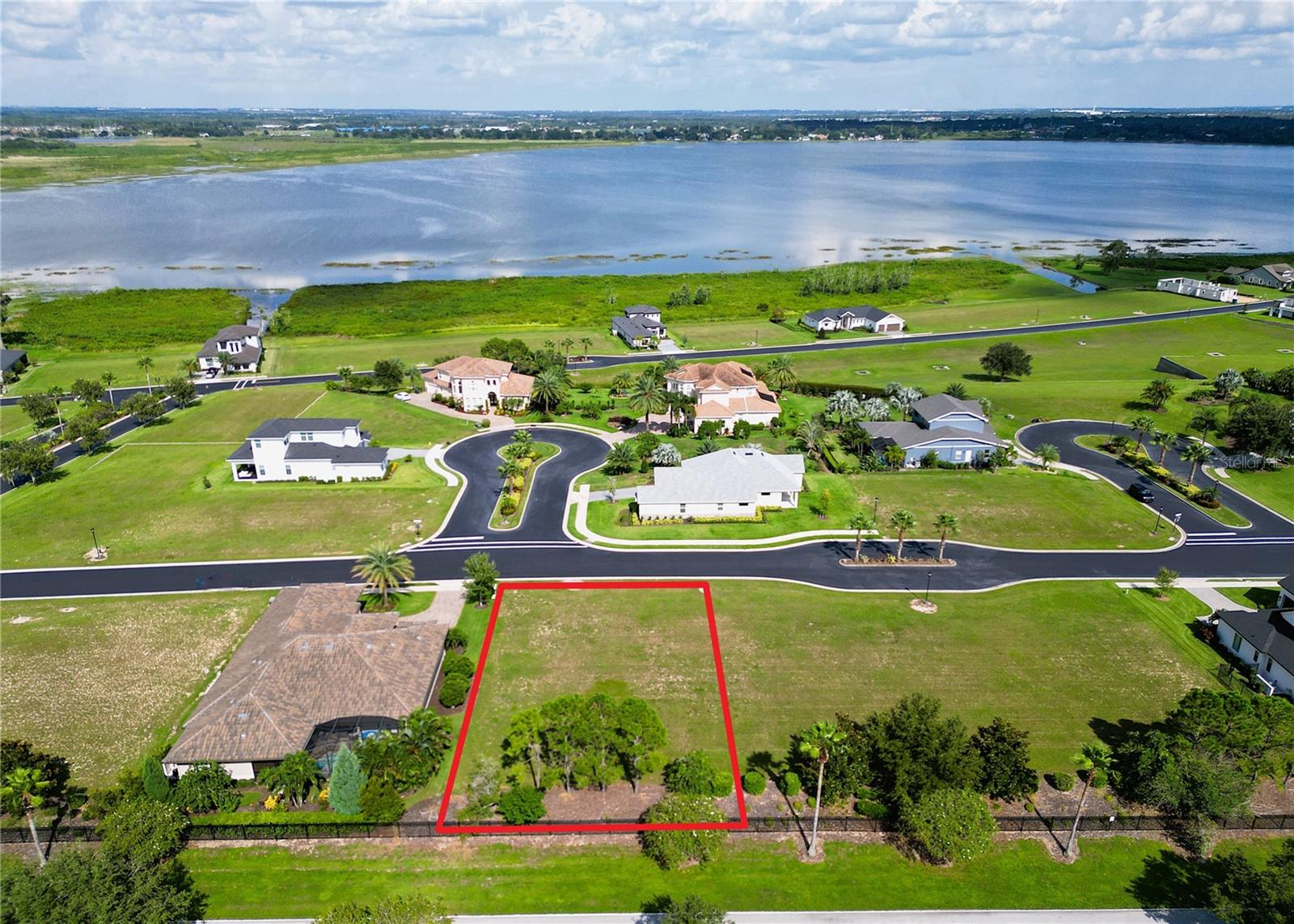 Build your dream home on this exceptional homesite in the highly sought-after Water Ridge community. Positioned at one of the highest elevations in the neighborhood, this lot showcases stunning views of Lake Alfred and the surrounding countryside—offering the perfect blend of tranquility and luxury.

Experience true resort-style living in this beautifully maintained, Gated community featuring an impressive array of amenities. Residents enjoy access to Tennis, Basketball and multiple Pickleball courts, 3 Pools (including a heated pool), Access to 3 Lakes, Boat Ramps, Fishing docks, Boat Storage, a large Fitness center, Sauna and a beautiful clubhouse. Perfectly located between Tampa and Orlando with easy access to I-4, you’re just a short drive from Universal Studios, Disney Parks, Legoland, premier shopping, dining, and much more!