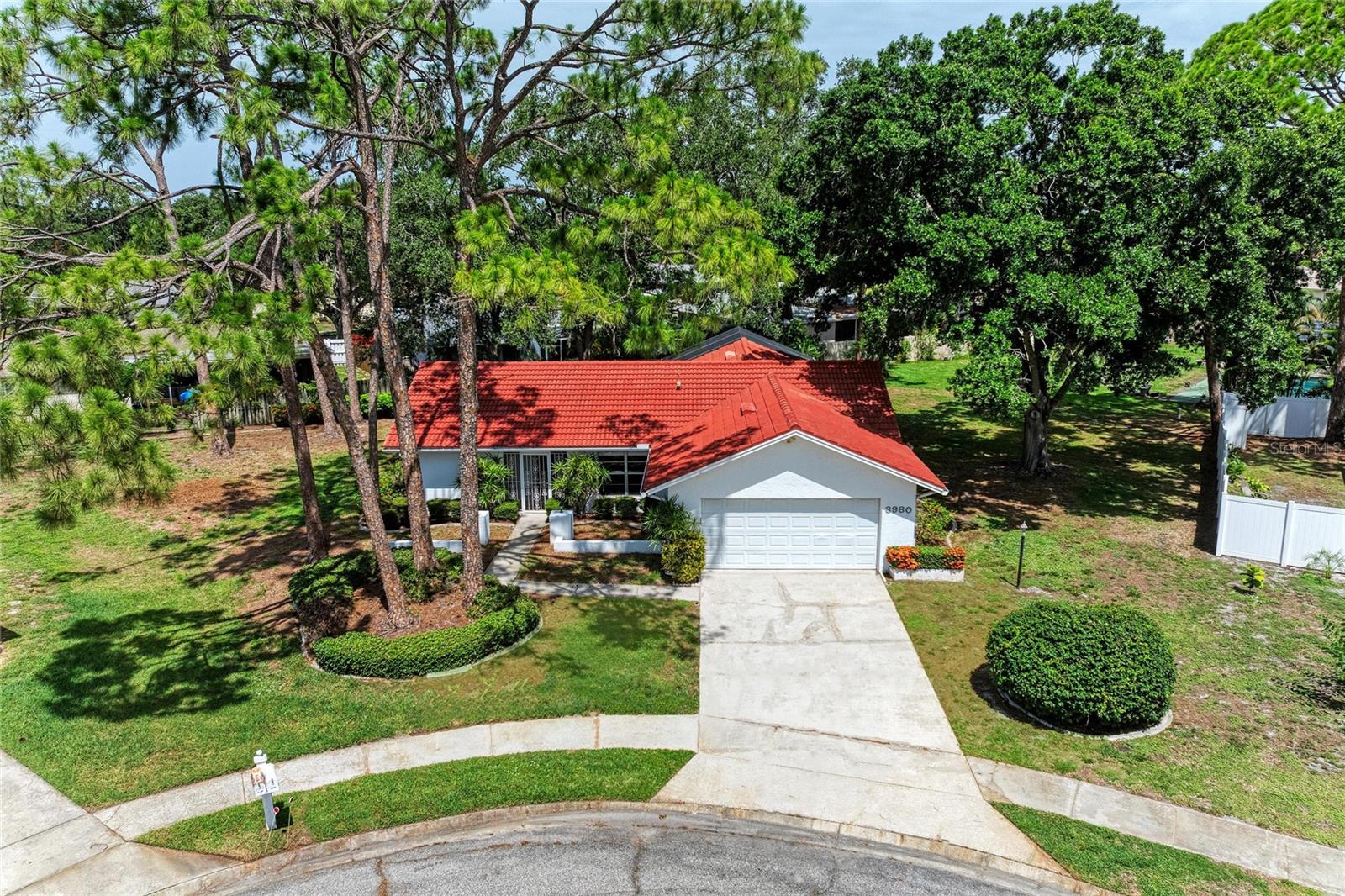 A private Sarasota pool retreat on over a quarter acre, tucked away on a quiet cul-de-sac in the desirable Tamaron community with low HOA fees and no CDD.

Welcome to 3980 Lemonwood Drive, a beautifully refreshed home offering the privacy, setting, and Florida lifestyle buyers are looking for. From the moment you arrive, the mature landscaping, peaceful lot, and quiet cul-de-sac location create a sense of calm that is hard to find this close to everything Sarasota has to offer.

This is the kind of home where everyday life feels like a retreat. Start your morning with coffee on the lanai, surrounded by lush landscaping and the privacy of your own backyard oasis. Spend afternoons by the pool, evenings dining outside, and weekends enjoying the best of Sarasota just minutes from your door. Whether you are relaxing in the shade, entertaining friends, or simply enjoying the quiet backdrop of your private lot, this home captures the reason so many people dream of living in Florida.

Inside, the home has been thoughtfully updated with a long list of improvements throughout. The kitchen features new appliances, a new sink and faucet, new garbage disposal, under-sink water filter, updated cabinet hardware, refreshed lighting, and repainted ceilings. The dining area has also been enhanced with a new chandelier, creating a clean and inviting space for everyday meals or entertaining.

The bathrooms have been refreshed with new fixtures, mirrors, medicine cabinets, cabinet hardware, exhaust fans, shower heads, paint, and repairs where prior grab bars were removed. Additional interior updates include new ceiling light fixtures, new blinds, new outlet and switch covers, new smoke alarm, updated closets with new shelving and paint, and fresh accent walls in the bedrooms.

The laundry area has been improved with new shelving and a stacked washer and dryer. The lanai and pool enclosure have also been upgraded with the removal of AstroTurf, a new fan and light fixture, removal of the screened partition between the lanai and pool area, and a complete rescreen with Super Screen and replacement fasteners using 304 stainless tapcons.

Tamaron offers a peaceful Sarasota neighborhood setting with mature trees, sidewalks, green space, and a convenient central location. Enjoy easy access to downtown Sarasota, Legacy Trail, shopping, dining, parks, and some of the Gulf Coast’s best beaches, including Lido Beach and Siesta Key.

With a private pool, oversized lot, cul-de-sac setting, mature landscaping, low HOA fees, no CDD, and a location close to downtown Sarasota and the beaches, 3980 Lemonwood Drive offers a rare combination of privacy, lifestyle, and convenience.