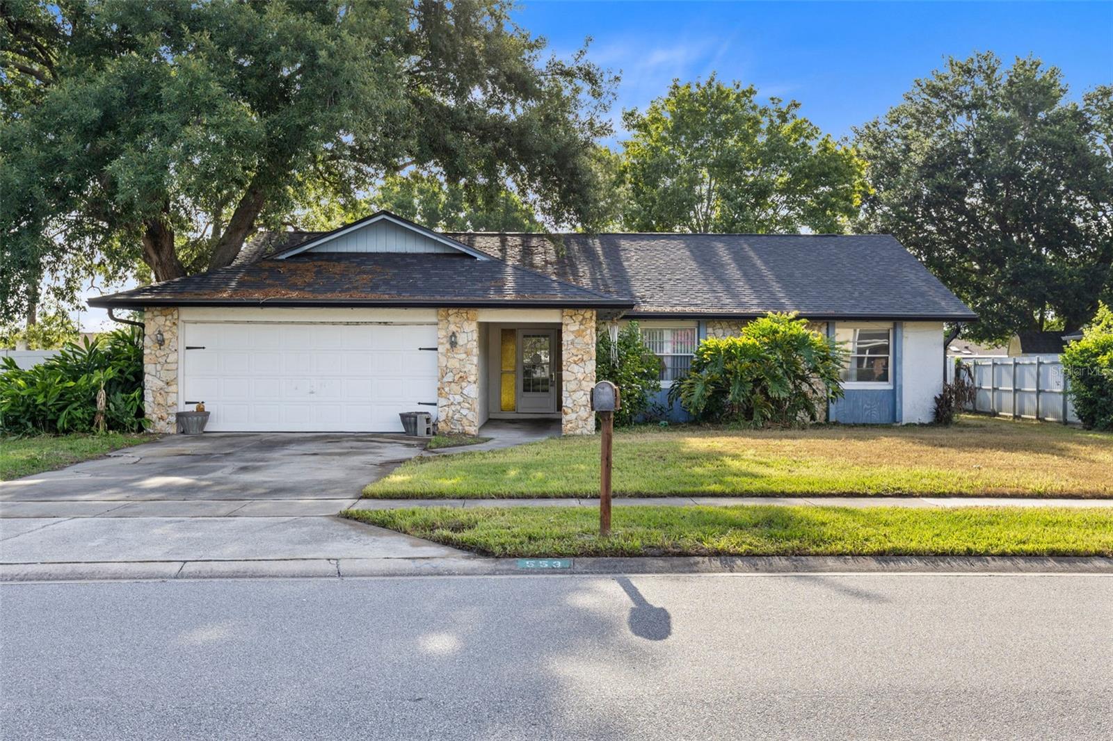 Opportunity knocks at 553 Mellowood Drive in Orlando! Situated on a spacious .34-ACRE LOT, this 3-bedroom, 2-bathroom home offers 1,769 square feet of living space and incredible potential for buyers looking to add their personal touch. Built with durable BLOCK CONSTRUCTION, the property features a NEWER ROOF, a fully fenced backyard, a screened-in back patio, and a 2-car garage. Inside, you'll find a functional layout with plenty of room to reimagine and update to your tastes, as the home is in need of cosmetic repairs and renovations. With an HOA of only $110 per year, ownership remains affordable while enjoying a PRIME EAST ORLANDO LOCATION close to shopping, dining, major highways, schools, and everyday conveniences. Whether you're an owner-occupant, investor, or someone searching for a value-packed property with upside potential, this GREAT PRICE and oversized lot make this one worth a look!
