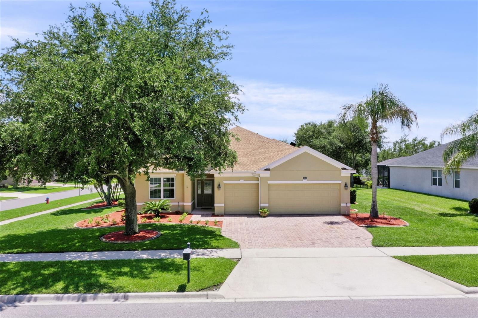 Amazing 4/3 corner home with paid-in-full SOLAR. 3-CAR garage with new floor coat.  ALL NEW landscaping/lawn.  Screened lanai.  GATED community.  Community pool, clubhouse, golf tennis, pickleball.  Close to shopping. Roof 2023.  Windows 2020. HVAC 2020. Tesla charger 2018.
