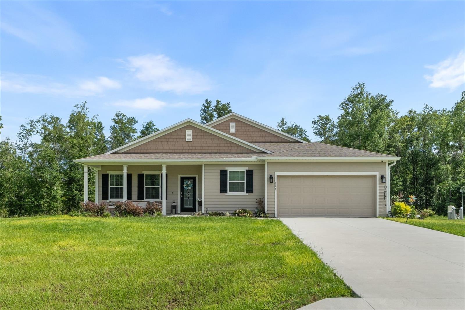 Welcome to this stunning single-story residence tucked away on a spacious 1.01 acre lot in the desirable Forest Cove community of Lake City. Built in 2025, this 3 bedroom plus in-Law suite, 3 bathroom home offers 2,455 square feet of thoughtfully designed living space with room to grow and space to breathe.
Step inside to soaring ceilings and an open, light-filled floor plan featuring crown molding, tray ceilings, and ceiling fans throughout. The living areas flow effortlessly into a well-appointed kitchen equipped with granite countertops, a dishwasher, microwave, range, and refrigerator, perfect for everyday living and entertaining alike.
The primary suite is a true retreat, complete with a spacious walk-in closet and a spa-like en-suite bathroom featuring a glass walk-in shower and separate soaking tub. Three additional bedrooms with generous closet space, making this home ideal for families or those needing extra flexibility for guests, a home office, or hobbies.
Enjoy Florida living at its finest on the covered front porch or the screened rear porch, both perfect for relaxing and taking in the peaceful, wooded surroundings. Additional features include a water softener, surround sound system, two car attached garage, HardiPlank exterior construction, a shingle roof, and rain gutters, all set on a low-maintenance slab foundation with no HOA fees.
this move-in ready home combines privacy, space, and modern comfort in one of Columbia County's growing communities. Don't miss the opportunity to make this beautiful property your own.