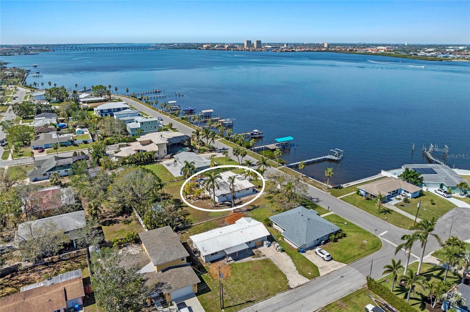 Double Waterfront Lot with Direct Manatee River Access - A Truly Rare Riverside Drive Opportunity. Opportunities like this are increasingly rare along Riverside Drive. Set on a one-of-a-kind double waterfront lot, this property delivers direct access to the Manatee River, expansive outdoor space, and the freedom of no HOA restrictions - a combination that is nearly impossible to replicate at this price point. Here, Old Florida charm meets wide-open possibility. Enjoy effortless boating with a straight route to Tampa Bay and the Gulf, plus ample room at home for boats, RVs, trailers, jet skis, work trucks, and every lifestyle toy imaginable, something few waterfront properties can offer. The setting feels private and relaxed, framed by mature trees and the steady rhythm of the river, yet remains just minutes from downtown Bradenton, riverfront dining, marinas, parks, and cultural destinations. The existing home is welcoming, functional, and move-in ready, allowing you to enjoy the waterfront lifestyle immediately. At the same time, the double lot creates an exceptional canvas ideal for expansion, redesign, or building a custom riverfront estate while maintaining privacy, open space, and direct water access. Morning sunrises light the backyard, afternoons invite you onto the water, and evenings settle into breezy golden light that only true riverfront living provides. Riverside Drive is known for its character, authenticity, and sense of place where neighbors value lifestyle over restrictions and waterfront living still feels personal. Whether you envision a peaceful waterfront retreat, a reimagined coastal residence, or a private compound with room to grow, this property offers a rare blend of location, flexibility, and long-term value - especially when compared to nearby vacant waterfront lots priced similarly without a home included. Just minutes to the downtown Bradenton Riverwalk and an easy 11-mile drive to the sugar-sand beaches of Anna Maria Island, this is more than a home, it’s a chance to secure a piece of timeless Florida waterfront, live at your own pace, and invest in a setting that continues to grow more valuable with time. Properties with this combination of land, water access, freedom, and price are seldom available. Schedule your private showing and experience the difference firsthand.