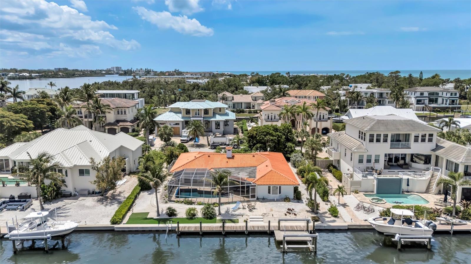 Premier waterfront opportunity in Longboat Key Estates, offering direct canal frontage in one of the island’s most desirable residential enclaves.
Positioned along a quiet interior street, this property offers the opportunity to own or build a custom coastal residence in an area undergoing continued redevelopment and investment potential. Surrounding properties reflect the neighborhood's transformation, with new-construction homes setting a high standard for modern, exclusive waterfront living.
The canal setting provides protected waters  for boating with access to Sarasota Bay, while deeded, private beach access offers the rare combination of boating and beachside lifestyle.
This property offers views of Sarasota Bay and the Intracoastal Waterway directly from your Lanai and dock, featuring a 100 feet of seawall frontage (2022) and a 16,000-pound boat lift (2022). Generous lot dimensions and a tranquil waterfront setting create an exceptional opportunity for boating enthusiasts and the ideal canvas for a thoughtfully designed custom residence. 
As a resident of Longboat Key Estates, a deed-restricted single-family waterfront community, you have deeded access to the Gulf and a private resident-only Tiki within a five-minute walk. 
Enjoy close proximity to Bayfront Park offering pickleball and tennis, kayaking, along within close distance to fine dining, St. Armands Circle, downtown Sarasota, Sarasota International Airport, and Florida’s Gulf Coast, all at your doorstep!