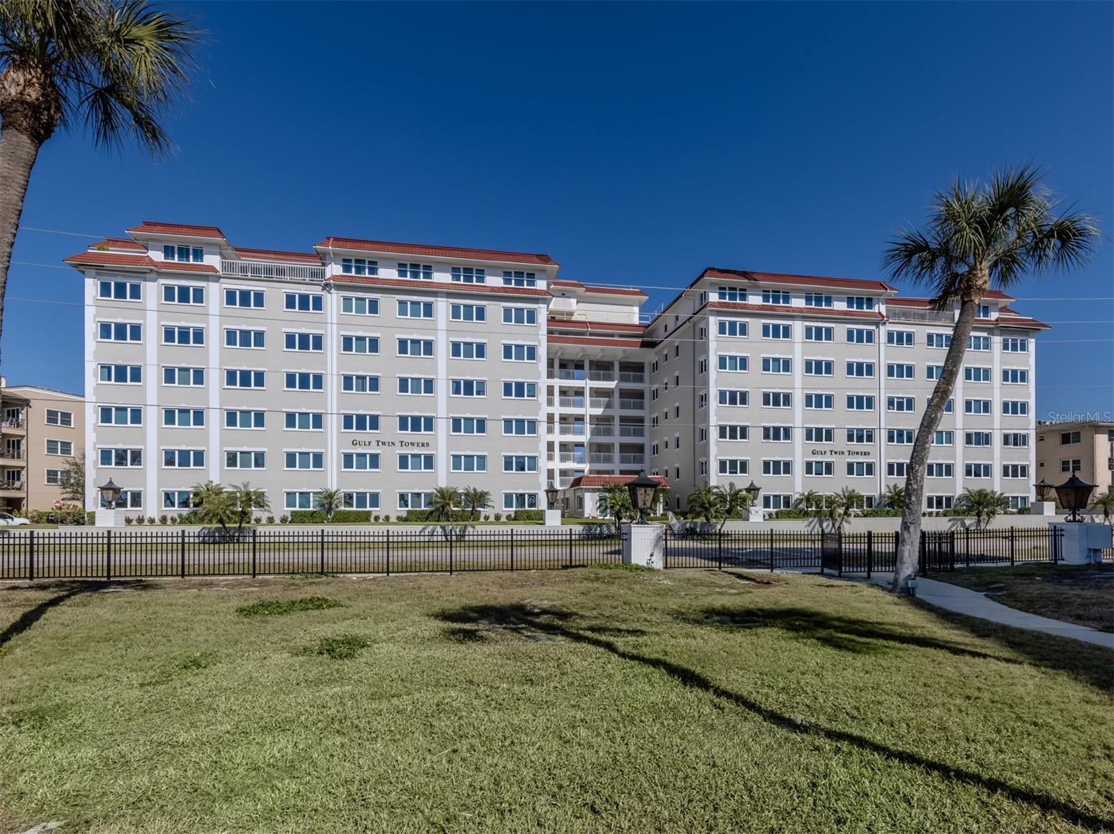 Beautifully updated and turnkey furnished with new furniture, this move-in-ready condominium in desirable Gulf Twin Towers offers effortless coastal living and outstanding value, ideal for a full-time residence, a seasonal retreat or an income-producing investment. From the moment you enter, you’ll appreciate the fresh, modern feel and thoughtfully upgraded finishes throughout. This spacious two-bedroom, two-bath residence showcases new porcelain tile flooring throughout, a fully renovated kitchen with new cabinetry, countertops and appliances, and tastefully updated baths with new vanities and fixtures. The well-designed floor plan includes a versatile bonus flex space ideal for a home office, reading nook or hobby area, plus a generous storage closet large enough for bikes, beach gear and seasonal items, a rare and practical bonus for island living. Enjoy added peace of mind with hurricane-impact windows and glass sliding door. Relax in the living room with a partial Gulf view and wake up to a full Gulf view from the primary bedroom. The primary suite features an oversized walk-in closet, providing exceptional storage and comfort, and an en-suite bath. Residents enjoy excellent amenities including a clubroom available for private gatherings and social events, a heated beachfront pool directly across the street, grilling area with picnic tables and an outdoor shower, ideal after a day on the sand. The community also offers ample guest parking along with an assigned covered carport for the owner. Stylish, comfortable and completely furnished with new pieces, just bring your suitcase and start enjoying the beach lifestyle right away. Ideally within short distance to downtown shopping, dining and popular Saturday Farmers Market, this condominium combines beachside relaxation with convenience of in-town living.