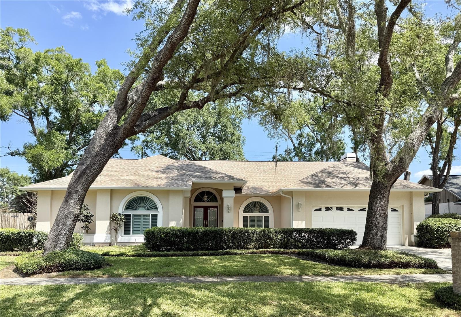 Nestled in the desirable Theresa Arbor community, this beautifully maintained 4-bedroom, 2.5-bath home offers the perfect blend of comfort, functionality, and Florida-style living. With a low annual HOA of just $238, this property provides exceptional value in a prime Temple Terrace location. Step inside to discover a spacious split-bedroom floor plan designed for both everyday living and entertaining. The home features a cozy wood-burning fireplace, formal living and dining spaces, and an inviting open flow to the outdoors. The sliding glass doors off the formal living area fully open, seamlessly connecting the interior to the expansive covered and screened patio—perfect for hosting gatherings or simply enjoying the Florida lifestyle. The thoughtfully designed layout includes two bedrooms and a full bath tucked behind a pocket door, creating an ideal guest suite or private mother-in-law quarters. The outdoor living space is truly a standout, featuring a large covered and screened patio overlooking a sparkling pool, plus an additional outdoor fireplace that stays with the home. The backyard is beautifully framed with areca palms along the rear for added privacy and a tropical feel. The kitchen comes fully equipped with all appliances included—plus a bonus garage refrigerator. The TV mounted over the fireplace also conveys, making this home move-in ready. Recent updates provide peace of mind, include - main roof and A/C replaced just 4 years ago, windows installed in 2022, hot water heater in 2023, guest bathroom remodeled in 2020 and primary bathroom remodeled in 2018. New Plantation Shutters throughout the home in 2025. Conveniently located near USF, Busch Gardens, MOSI, area hospitals, and I-75, this home offers easy access to downtown Tampa and beyond. Residents also have the option to join the nearby Temple Terrace Recreation Center and Temple Terrace Golf & Country Club for additional lifestyle amenities. This is a rare opportunity to own a well-appointed pool home in one of Temple Terrace’s most established neighborhoods—schedule your private showing today! The Temple Terrace Golf and Country Club is offering a 3-month complimentary social membership to new residents of Temple Terrace.