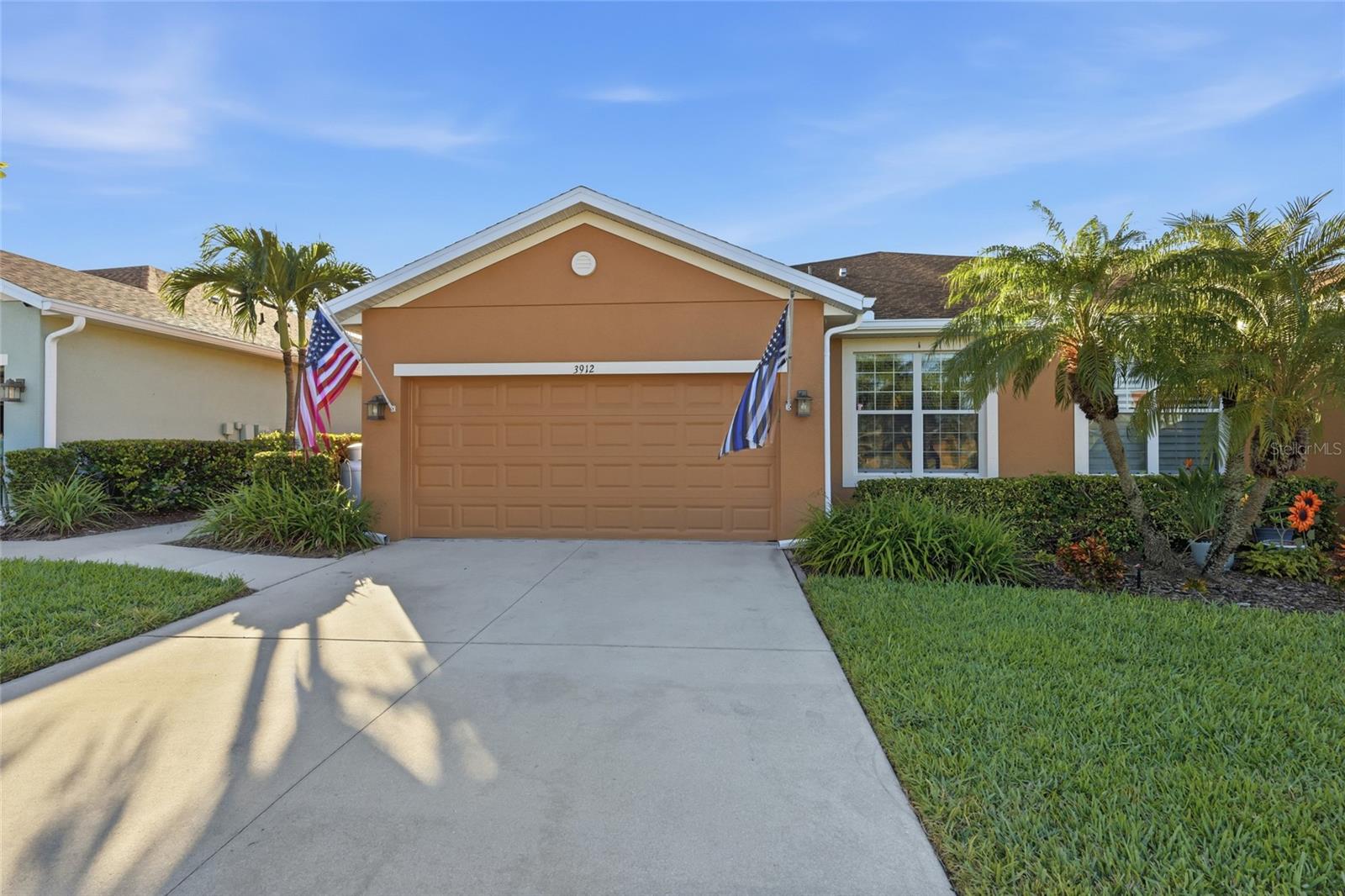 *** PRICED TO SELL*** Welcome to Palma Sola Trace, an established community just three miles from the gorgeous beaches of Anna Maria Island. The home you are looking at is 1852 feet of updated well-planned space. You enter from the covered front porch into a large open living space. This is where the sellers began their upgrades. The former elevated bar was removed, and surface was lowered to counter height and replaced with a massive granite peninsular. It boasts a new rectangular stainless-steel sink and contemporary black fixtures. The kitchen cabinet handles were replaced in black to match. This has become the perfect gathering place. The living space is wired for a wall mounted flat screen TV. To the left are 8-foot by 12-foot patio doors looking out over the extended lanai, lush palms and an astroturf covered rear yard. Outside the lanai is a patio for any of your BBQ toys. Inside the home is an open dining area, big enough for the largest table. If you like to cook, you will love the kitchen. It has a top-of-the-line GE profile refrigerator, GE profile dishwasher, a GE microwave, and GE propane stove. The home has a propane instant hot water heater mounted on the side of the home. The propane tank was approved by the HOA due to its energy efficiency. You will never run out of hot water or need to juggle your pans off the hot electric burner. The home has three bedrooms plus a den split floorplan. The primary bedroom has a large private bath, with dual vessel sinks and a large walk-in shower. The shower was replaced with large floor to ceiling wall tiles and geometric floor tiles. The primary closet has added shelving to accommodate all your clothing storage. The split floorplan locates the other two bedrooms, the office, the laundry room and a shared hallway bath at the front of the home. All the bedroom closets have additional added shelving and racks for clothes storage. The shared bath also was updated with matching granite countertops and a vessel sink. The laundry room has full length wall cabinets over the newer front load washer and electric dryer. The original plastic sink was replaced with a stainless-steel utility sink and a matching granite countertop. All the ceiling mounted flood lights and lightbulbs throughout the home were replaced with dimmable energy efficient LED bulbs. Mounted in the attic is a digital tv antenna for broadcast tv should cable go out. It is connected directly to the TV in the living room and the office. The home is pre-wired for a 50-amp back-up generator. Mounted on the lanai are two LED spotlights that totally illuminate your fully fenced in rear yard. This is perfect for your fur babies at night or day, they will love it. There is a two-car garage loaded with wall shelves to store everything. The roof was replaced February 2026, and the exterior was painted by in 2025. All this is covered by the HOA along with landscaping, cable TV, internet, pool, clubhouse. Best of all you are less than 3 miles from Anna Maria Island,