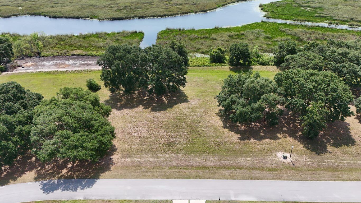 DISCOUNTED $50,000 BELOW ORIGINAL LIST PRICE AND PRICED TO SELL WITH DIRECT LAKE ACCESS IN GARDEN CITY!! A PREMIER GROVELAND NEIGHBORHOOD SET IN A MAGINIFICENT WATERFRONT LOCATION. LOT 34 PROVIDES DIRECT AND EXCLUSIVE ACCCESS TO THE UPPER CHAIN OF LAKES INCLUDING LAKE STUART, LAKE HUNT, LAKE LUCY AND LAKE EMMA. PRICED MARGINALLY ABOVE NON LAKEFRONT INTERIOR LOTS AND SIGNIFICANTLY BELOW MARKET VALUE FOR COMPARABLE WATERFRONT LOTS THIS IS A PERFECT OPPORTUNITY TO BUILD A TRUE CUSTOM LAKE FRONT HOME. HOMES MUST HAVE A MINIMUM OF 3800 SQUARE FEET UNDER AIR AND ARE SINGLE STORY ON THE WATERFRONT LOTS. YOU CAN BRING YOUR OWN BUILDER WITH NO CURRENT HOA RESTRICTION ON TIME TO BUILD AFTER PURCHASE. Seller is a Licensed Florida Real Estate Broker.