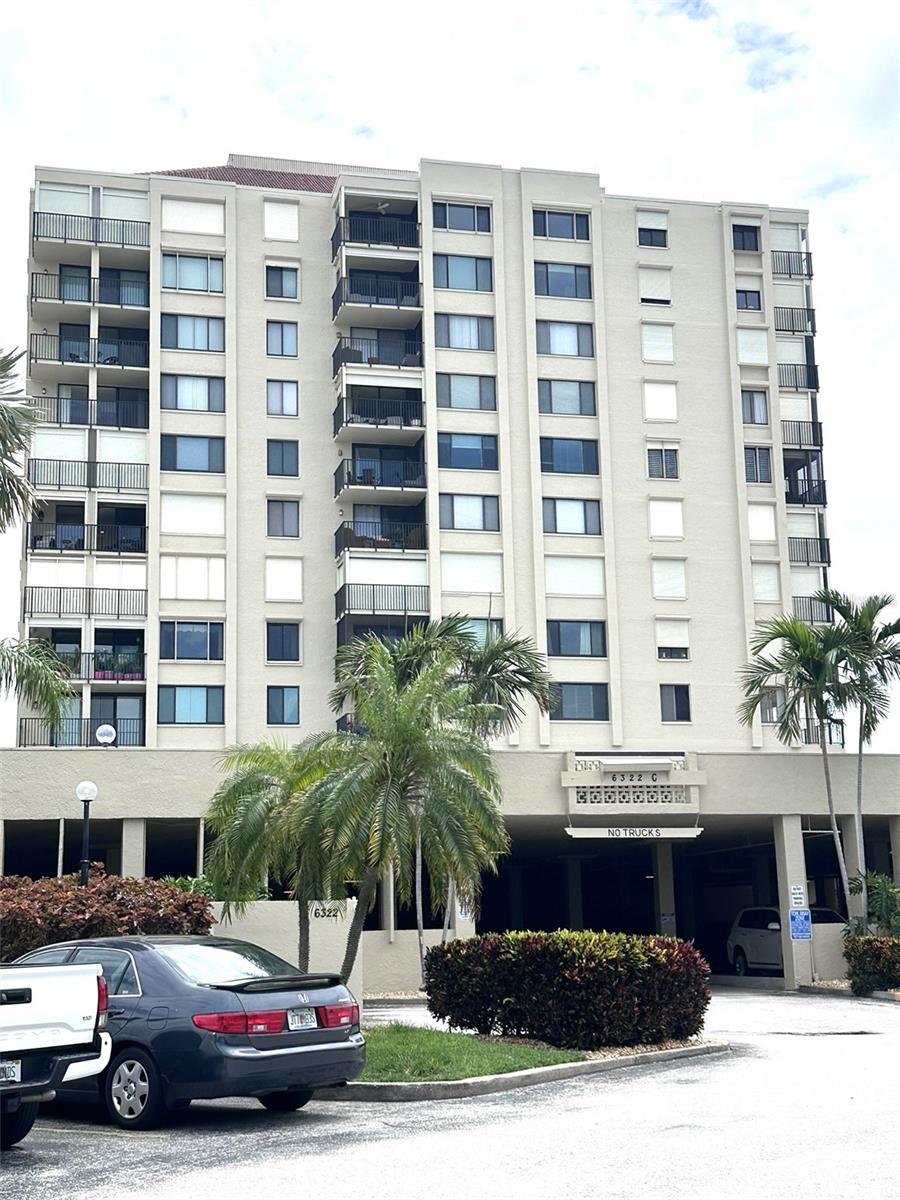 Great opportunity to update/renovate this 4th floor corner water view (partial) to your own style!  Brand NEW central H&A May 2026. This is a one-owner unit since 1981.  1150 sq. ft. split floor plan with balcony and partial water views including Sunshine Skyway Bridge from Living Area and Primary Bedroom. Kitchen has solid wood cabinetry that could remain in place and be refinished.  Tile throughout living area is in excellent condition.  Berber carpet in bedrooms. Original primary shower/toilet area in great condition for its age as well as bathtub/tile in hall bath.  Commercial full size washer-dryer included. Small pet allowed under 15 lbs.  Rental minimum stay is one month. Covered parking space in the parking garage #59.  Monthly HOA fee includes the water/sewer/garbage/ext. cable/Internet/WiFi/flood ins and more.  Beautiful waterfront heated pool and spa for your use.   Location Location! Golf Course/Country Club community of Isla Del Sol.  Short drive over to St. Pete Beach, Ft. DeSoto, restaurants/shops, downtown St. Pete and easy access to I275/Sunshine Skyway.