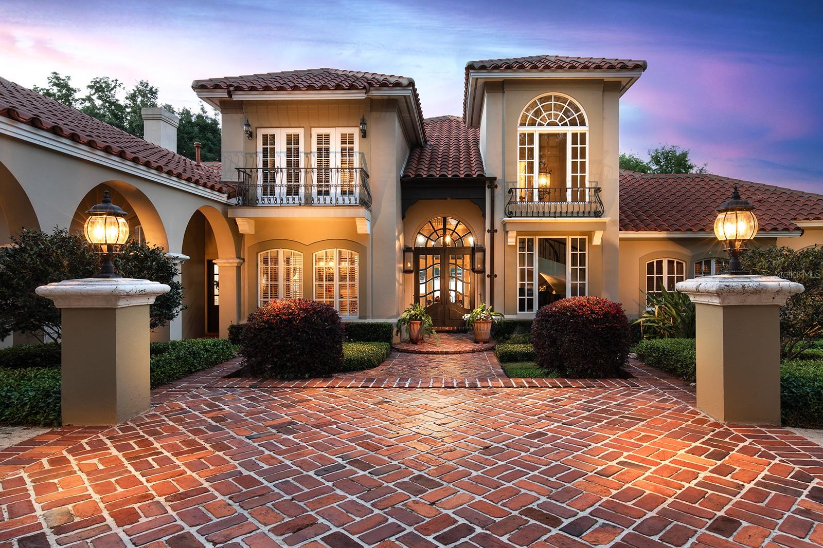 CRUISING THE WATERWAYS of the MAJESTIC SPRING FED LAKE BRANTLEY await you. Stroll around your sculptured & manicured gardens.  Elegant entry features include PORTE-COCHERE. Biltmore GAS LANTERNS, SHUTTERS, BALCONIES & TOWERING tree canopies as you approach this MEDITERRANEAN-RIVIERA style estate.  The cultivated beauty of this "one-owner home". Impressive CUSTOM-BUILT SHOWPLACE is nestled back on a LUSH, PRIVATE ENCLAVE, oversized *4-Acre lot. *Over 1+ acre for residence. WATERFRONT LIVING at its' finest. 4/5 Bedrooms, 5.5 baths, pool home, 3 car garage, porte-cochere, pool/ spa, and dock with BONUS/FLEX space in the basement, perfect for a workout room. Over $380,000+ in updates & renovations. Majestic MAHOGANY entry doors welcome you, and once inside the seamless floor plan is OPEN w/ VOLUMINOUS ceilings (10-foot ceiling throughout, Primary bedroom 12 ft, other rooms 20 ft.). EXPANSIVE living/dining/kitchen/ family rm w/ PANORAMIC, BREATHTAKING WATER, VIEWS that engulf most rooms. SUN DRENCHED lighting pours in as it illuminates the CUSTOM-BUILT with HIGH-QUALITY finishes and fixtures that enhance the architectural elegance. Tongue & Groove Cedar ceilings in fam & breakfast rm, & porch. Interior solid core 4 panel wood doors throughout.  Generous use of ST. LOUIS BRICK, WOOD flooring, WROUGHT IRON accents and 2 palatial wood burning fireplaces. EXCITE the CHEF with this dream kitchen while overlooking expansive water views! Create culinary masterpieces in style. An abundance of cabinetry, storage, island, massive dinette and a snack bar. STAINLESS STEEL appliances, GRANITE prep space & HIGH-END fixtures make this functional & impressive. Wet bar w/ GRANITE snack bar/cabinets sit under the upstairs LOFT area. 3-way split bedrooms with private baths, are perfectly situated around the living / family rm and dining space. All the bedrooms are roomy with large closet space; one even has a window seat. All bathrooms are situated near bedrooms which make it perfect for privacy and versatility. Library/ office with solid CHERRY WOOD finishes line the walls & solid wood beamed ceiling can be used for the 5th bedroom or nursery. Regal Master bedroom DOWNSTAIRS, with 12' ceilings, sitting room space & ensuite bath SPA like retreat. MARBLE galore! Step into the Roman tub, or roomy walk-in shower with private atrium. Dual sink cabinets, MARBLE counters & a BIDET and don't forget the enormous walk-in closet.  Spiral wood and wrought iron staircase lead to LOFT with additional flex space & bathroom. Peak into the basement for additional BONUS space, with its own bathroom. So many possibles for this area. OPULENT OUTDOOR RESORT living OASIS w/ OUTDOOR KITCHEN, and your own private SANDY BEACH to build your own sand sculptures on. This is the perfect space for entertaining and making memories. Ride the waves, ski or boating & relax & watch the incredible SUNSETS over the lake. Wood dock leads to your private lift & covered space. Brand new Kohler Generator too!  Relax and enjoy the ambiance. the sights and sounds of the rippling waters lapping around you and the tranquility of this one-of-a-kind residence. Spend a LAZY afternoon fishing/skiing the 288-acre Lk. with its PRISTINE waters & SANDY BEACH bottom. RELAX with a glass of wine, as you have reserved SUNSET seating as you watch the MOONLIGHT dance the night away. Desirable location that is close to all shopping, major roadways, restaurants and top schools.