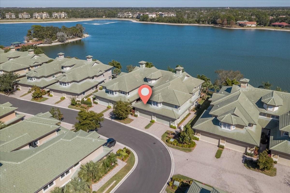 Location, location, location! Remodeled June 2026 home that you must check out!
Don’t miss this rare opportunity in The Moorings at Lakewood Ranch, a gated waterfront enclave maintenance free living community known for its exceptional lifestyle, private island, and unbeatable proximity to everything Lakewood Ranch delivers including only half a mile to Main Street!

This beautifully updated two-bedroom, two-and-a-half-bath waterfront condo is ideally positioned on one of the community’s most desirable lots, showcasing unobstructed scenic waterfront views of Lake Uihlein to both the right and left. The highly coveted two-car garage is a rare and valuable find in this community. Virtual staging used in select images to deliver inspiration and ideas!

Step outside and feel the stress melt away as sunsets reflect across the water, creating a serene and picturesque setting. Enjoy peaceful mornings, golden evenings, and incredible bird watching. This home sits in best zone X, not located in flood zone AE. This home offers added peace of mind and less stress! The property been meticulously maintained.

Inside, the updated kitchen features Cambria quartz countertops, recently upgraded appliances, new luxury vinyl flooring in the home, fresh paint, and more!  ideal for everyday living and entertaining. An abundance of ice from two ice makers makes hosting effortless, perfect for gatherings or warm Florida days. The home also features a dedicated bar area, ideal for entertaining and evening gatherings.

The thoughtfully designed floor plan includes a designated office area and a second living room or den, offering flexible space that could easily be converted into a third bedroom if desired.

This is truly maintenance-free living with no landscaping, exterior pest control, painting outside, lawn work, roof replace or repairs, or irrigation to worry about. Internet and cable are included. The community is supported by a responsive on-site community manager, making day-to-day living easy and seamless.

Residents enjoy exclusive access to a private island with boardwalks, gazebo, fishing pier, docks, kayak storage, and an optional boat club. Community amenities also include a clubhouse with full kitchen, library, billiards, fireplace, fitness center, and event space, along with a resort-style heated pool and spa, outdoor Tiki bar, BBQ grilling area, and bocce ball.

The location is unbeatable! Walk on over to Publix for everyday groceries and enjoy easy access to restaurants, boutique shopping, cinema, mini golf, and year-round events at Lakewood Ranch Main Street. Just 2.4 miles to University Town Center Mall and half a mile to Lakewood Ranch Medical Center. 

A rare combination of scenic water views, bar area, office space, flexible living options, a two-car garage, and true lifestyle convenience in the heart of Lakewood Ranch.

Homes like this don’t come available often. 
Schedule your private showing for this move in ready home today!