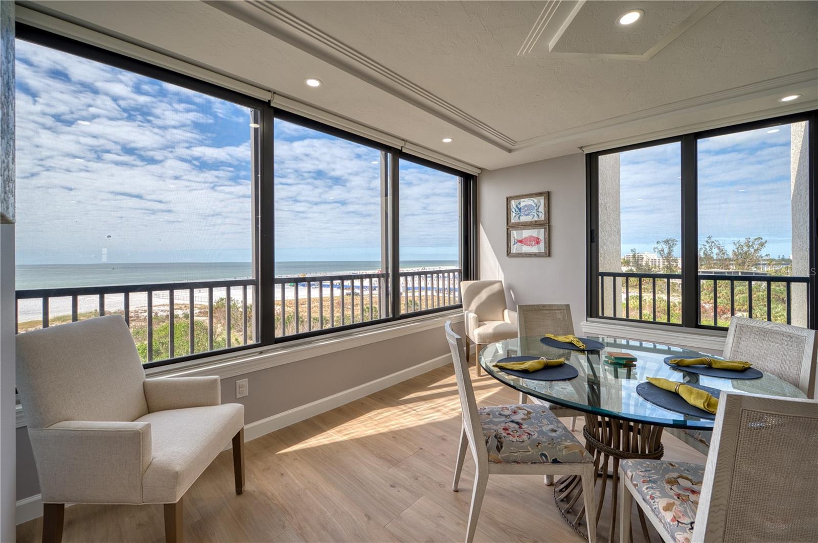 Discover the ultimate coastal lifestyle in this elegant 3 Bed/2 Bath condo, perfectly situated on the top floor of the beachfront F building at Gulf & Bay Club with breathtaking views of Siesta Key Beach. Spanning over 2000 square feet, this corner unit has been completely renovated and is offered turnkey furnished, ready for immediate enjoyment. Step inside to find sleek porcelain tile floors, recessed ceiling lighting, and an open floor plan that seamlessly blends elegance with functionality. The chef's kitchen is a showstopper, featuring stainless steel appliances, quartz countertops, solid wood cabinets with soft-close doors and drawers, a breakfast bar, a spacious island, and a dry bar with a 2-drawer beverage fridge. The beach facing windows are all impact glass, and there are remote-controlled shades on every window to complement the natural light. The spacious master suite is a private oasis with a spa-like bathroom boasting dual sinks and a stunning blue granite walk-in shower. There is plenty of storage with a linen closet and a walk-in closet with built-ins. Two additional bedrooms provide ample comfort for your guests. Additional highlights include a foyer with a coat closet and a bench seat with additional storage. You will appreciate the convenience of your own laundry room. This exceptional condo offers the perfect combination of luxury, comfort, and unbeatable coastal living. Nestled on 32 lushly landscaped acres, Gulf & Bay Club offers the ultimate resort-style living. With 800 feet of private beach, you’ll enjoy breathtaking views, serene sunsets, and direct access to your own slice of paradise. This vibrant gated complex is designed for relaxation and recreation. Amenities include 3 sparkling swimming pools, a rejuvenating indoor hot tub, several dry saunas, pickleball, tennis, basketball, racquetball, and shuffleboard courts. There are two clubhouses, a well-appointed fitness center, multiple BBQ areas, Electric Vehicle charging stations, and a car wash area. A guest suite, available exclusively for owners can be reserved for visiting family and friends. Just a short stroll or free shuttle ride to the Siesta Key Village restaurants and shops or a short drive to downtown Sarasota, this community combines tranquil coastal living with easy access to urban conveniences. Whether you’re relaxing on the beach or staying active on the courts, Gulf & Bay Club truly has something for everyone. It is more than just a home—it’s a lifestyle.