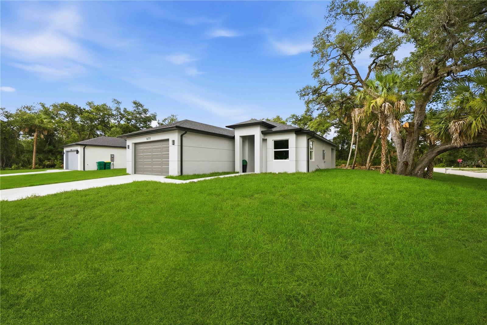 Brand-NEW construction in a highly convenient location! This modern home features TAJ MAHAL QUARTZ countertops with a stunning WATERFALL edge, complemented by CUSTOM wooden SLATS detailing and LED under-cabinet lighting. The kitchen is equipped with STAINLESS STEEL appliances and thoughtfully designed WOODEN SHELVING that continues throughout the home for a warm, contemporary feel.

Enjoy TILE FLOORING throughout, HIGH-TRAY CEILINGS with sleek contemporary VENTS, and IMPACT/energy-efficient WINDOWS. The bathrooms and laundry room showcase DESIGNER tile and LARGE-format TILES in showers for a clean, upscale finish.

Situated on an OVERSIZED corner lot with MATURE trees, this property offers both style and space—perfect for comfortable living and entertaining.